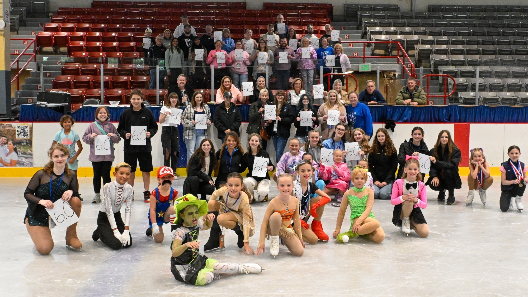 Competitors, officials, spectators and coaches give the 6.0 scoring system an historic sendoff at the 50th annual Kathy Slack Troy Summer Competition in Troy, Ohio.