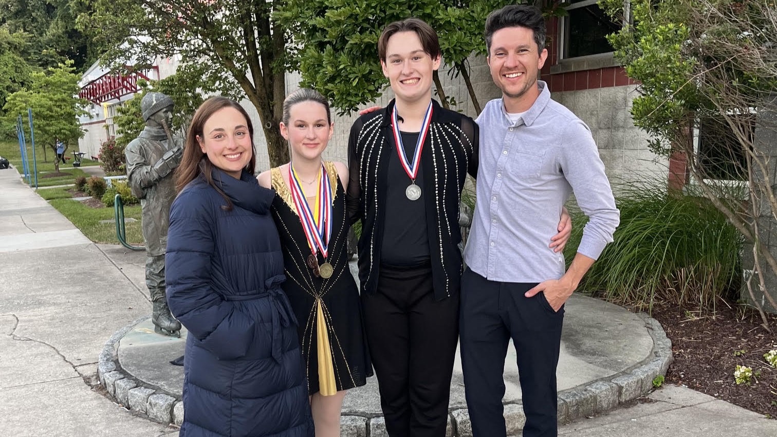 Siblings Kirsten Bertz Evan Bertz are flanked by coaches Anastasia Cannuscio and Colin McManus