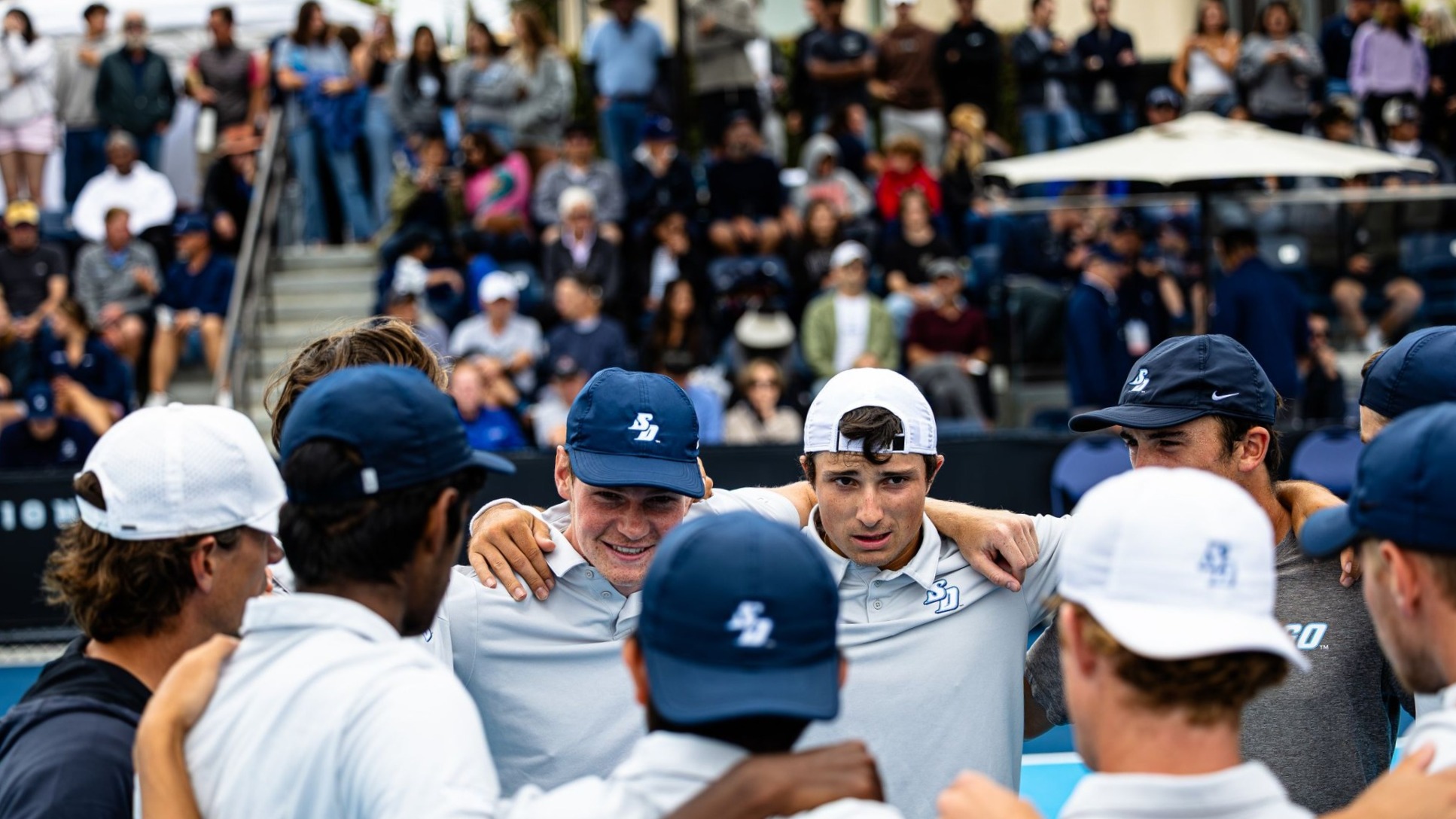 Adrien Berrut and Lambert Ruland Huddle