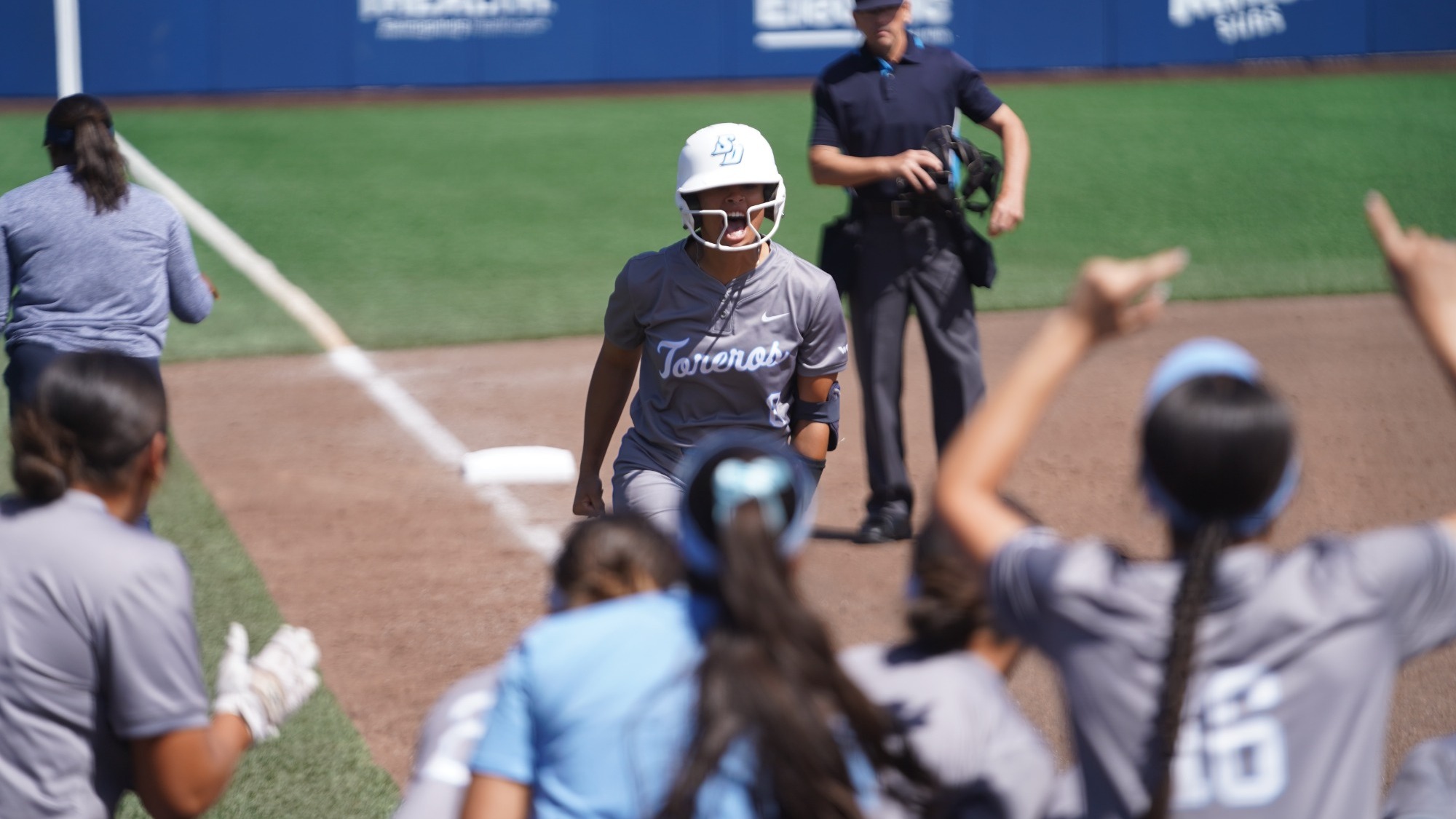 Janae Combs celebrating a home run