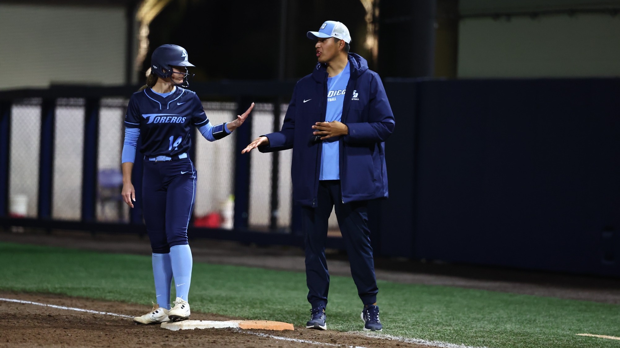 Taylor Johnson talking to first base coach