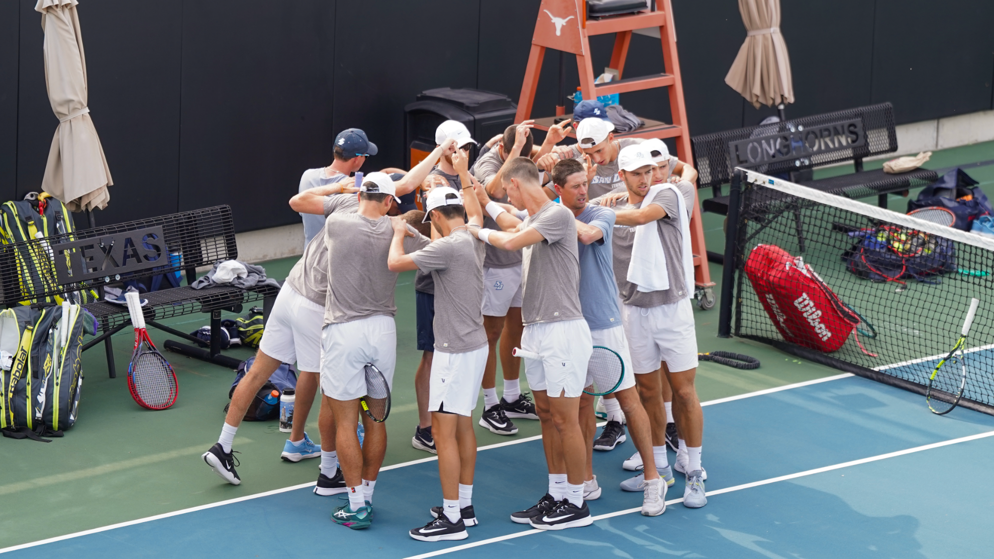 USD MTEN huddle at Texas NCAA Sweet 16