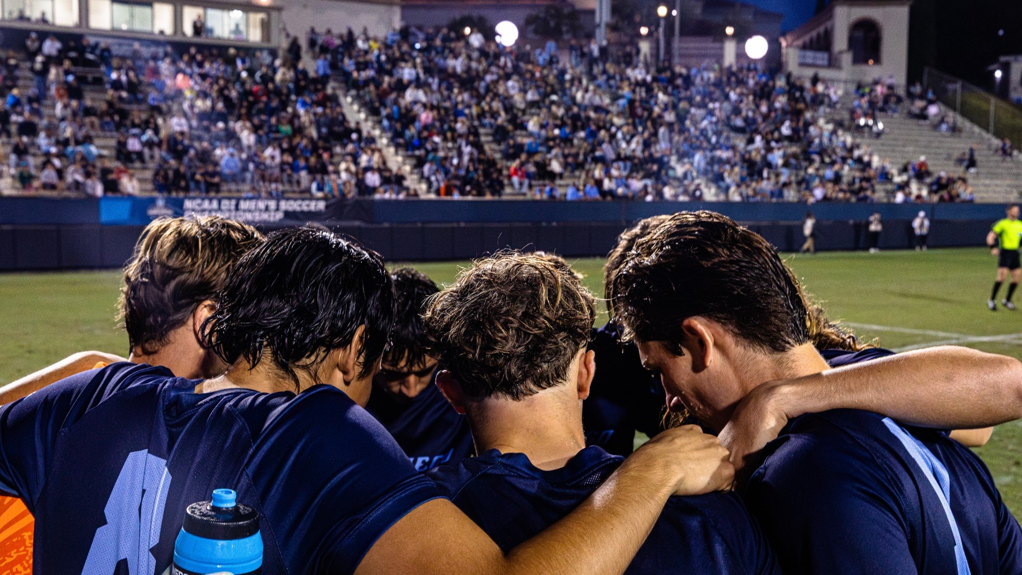 USD soccer pregame huddle