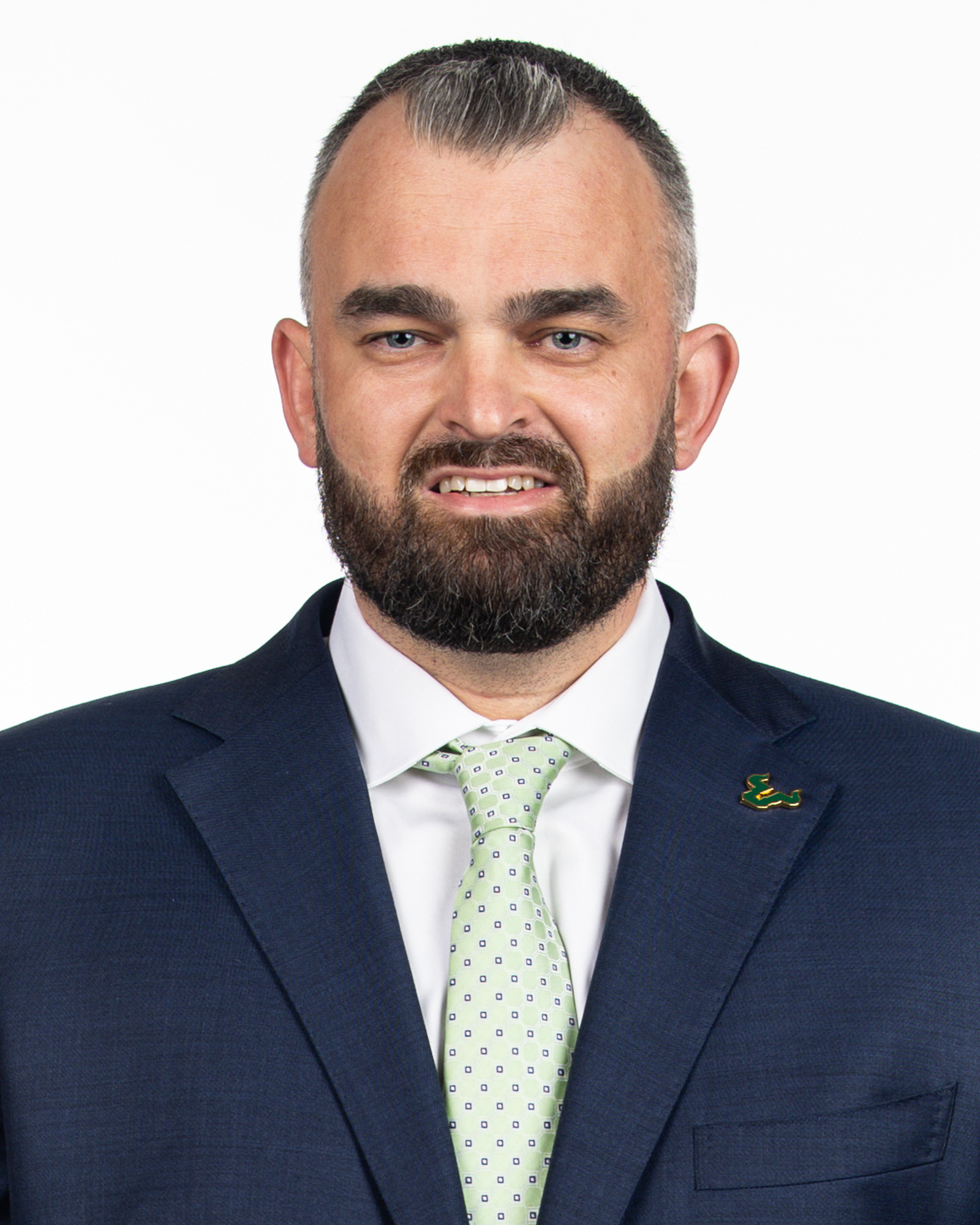 Bryan Hodgson poses for photos on March 28, 2025 before his introductory press conference.

(Stephen Galvin / University of South Florida Athletics)