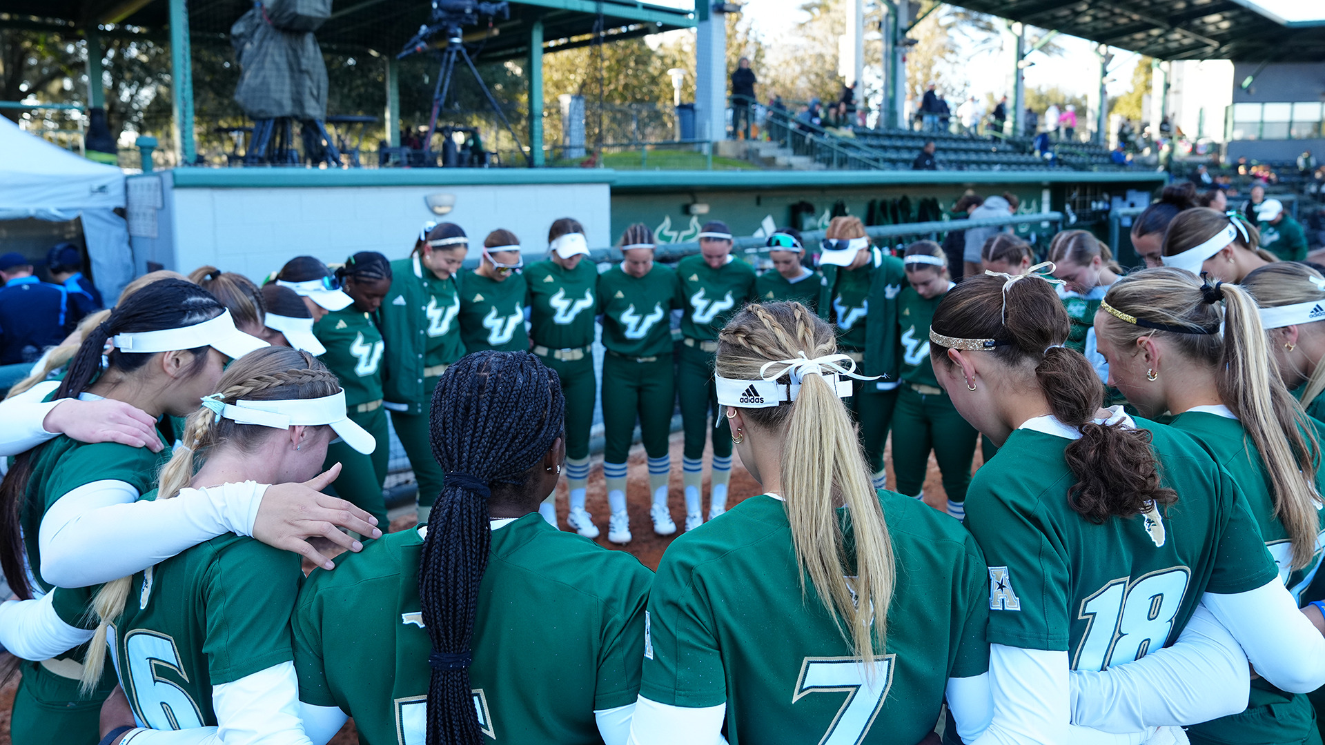 Softball pregame huddle opening weekend