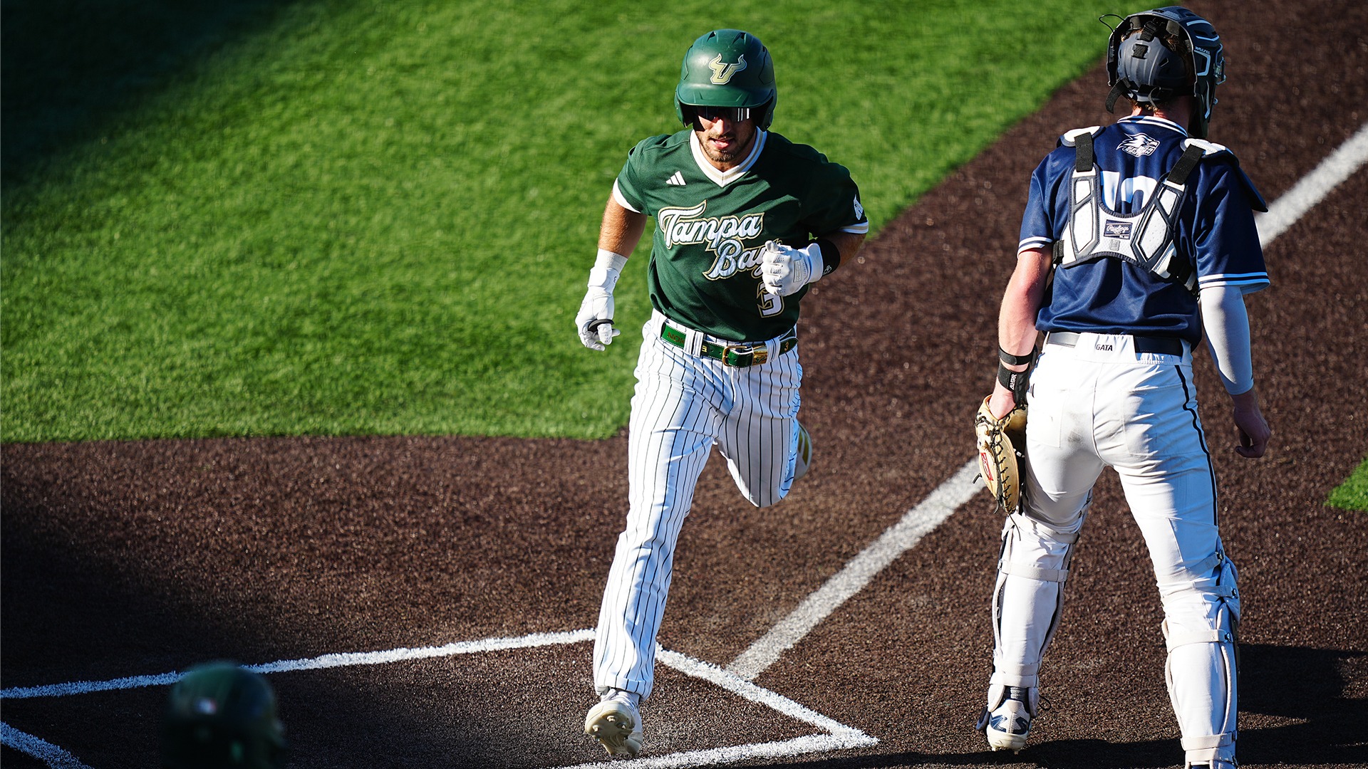 Bradke Lohry scoring a run