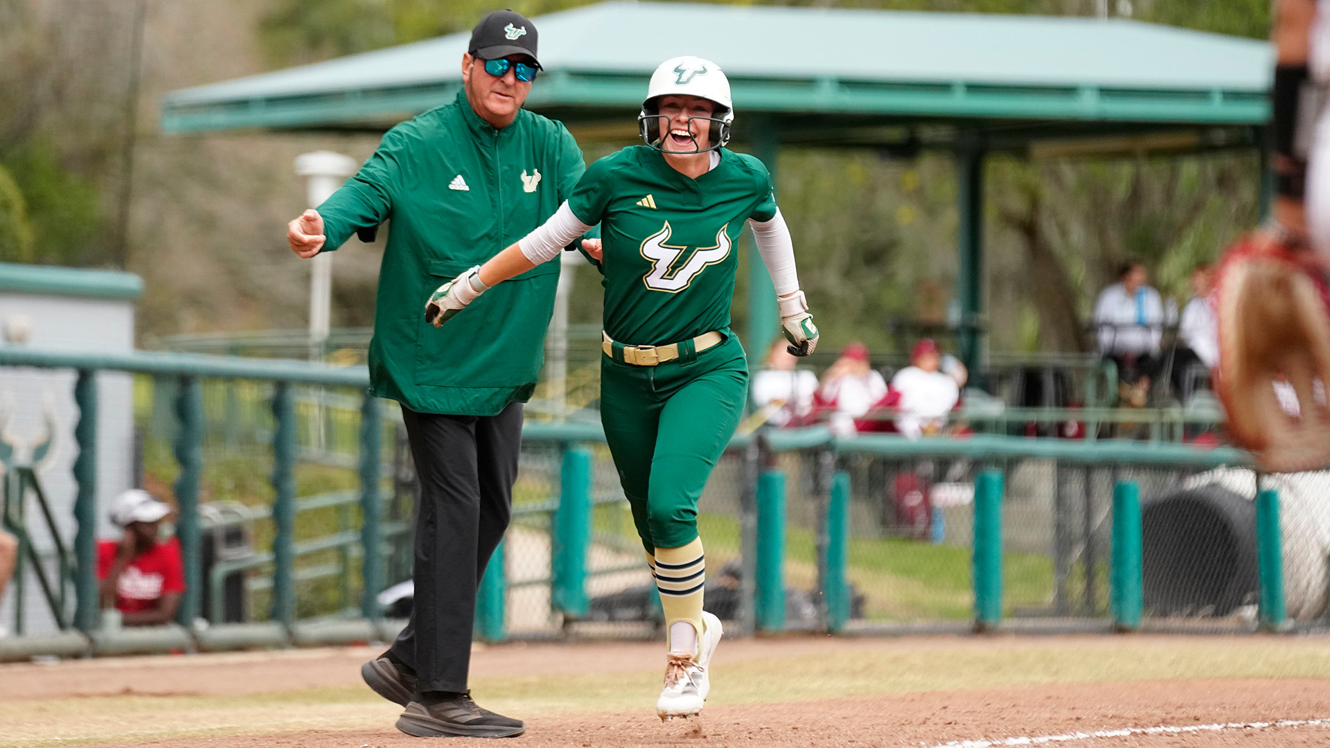 Olivia Elliott rounding third after hitting a home run