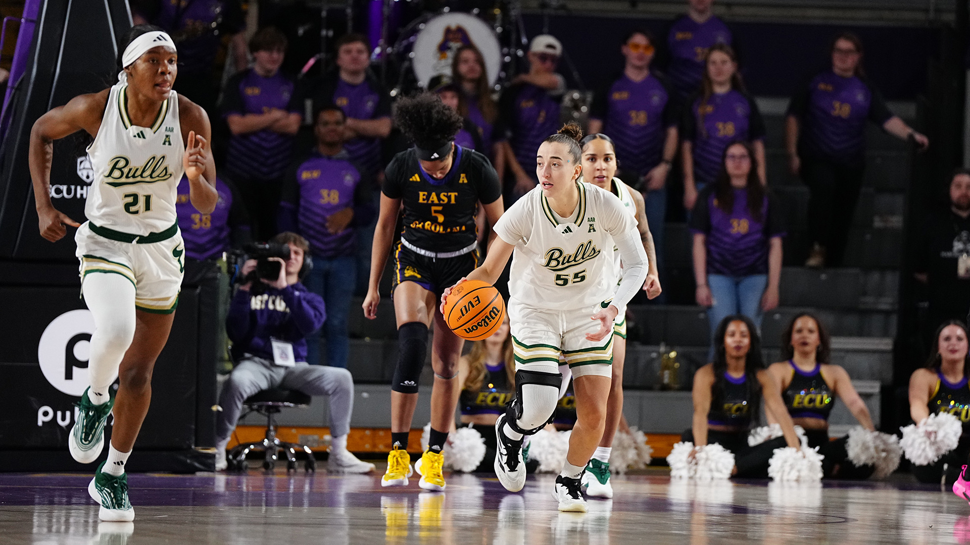 Carla Brito and L'or Mputu running down the court at ECU