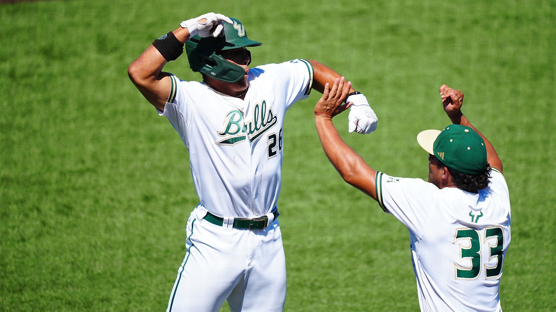 Nathan Earley and Santiago Carriles celebrating Earley's home run.