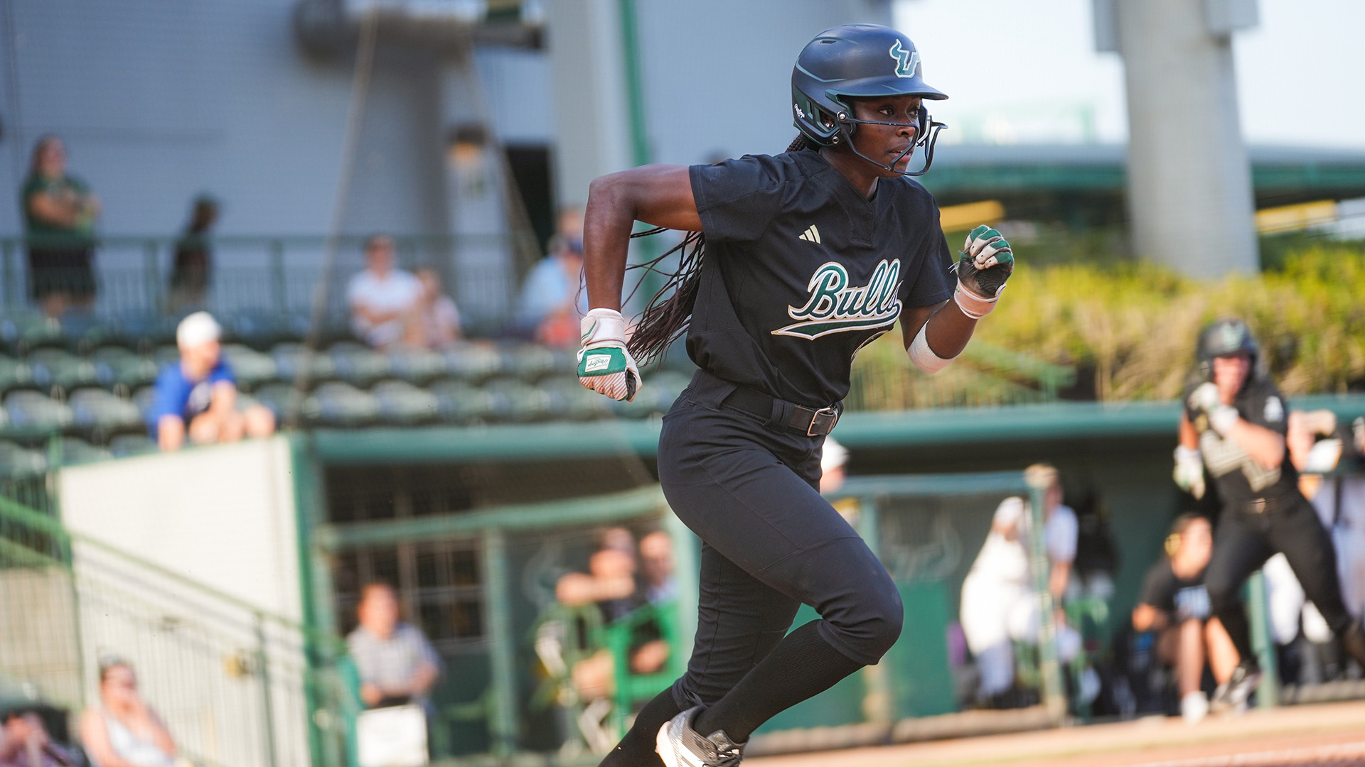 DaNia Brooks hustles down the first base line on a single against Wichita State