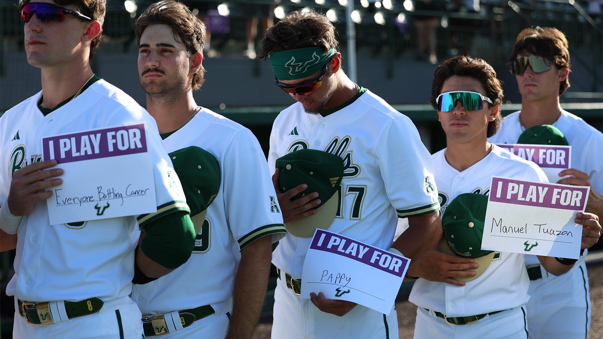 Players lined up for national anthem on Strikeout Cancer night.
