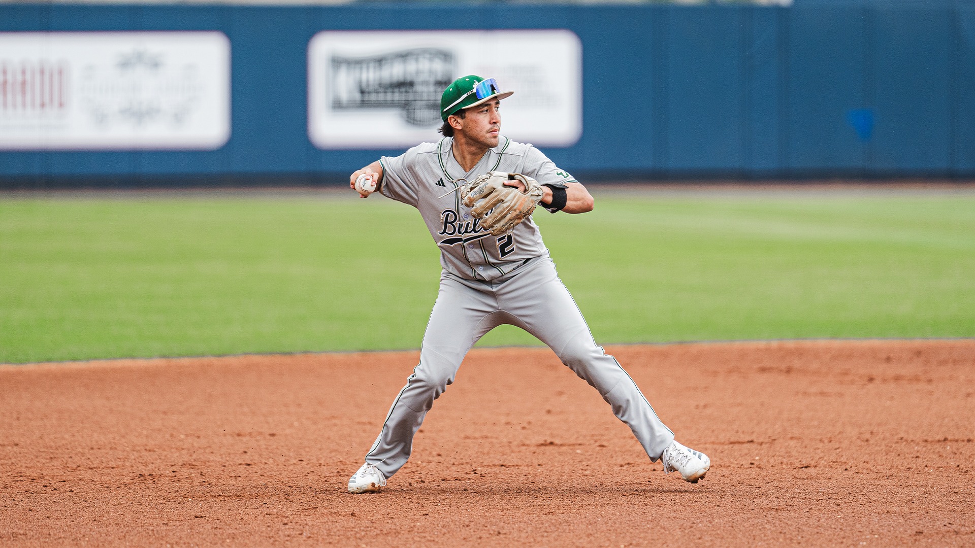 Matt Rose playing third, about to throw.