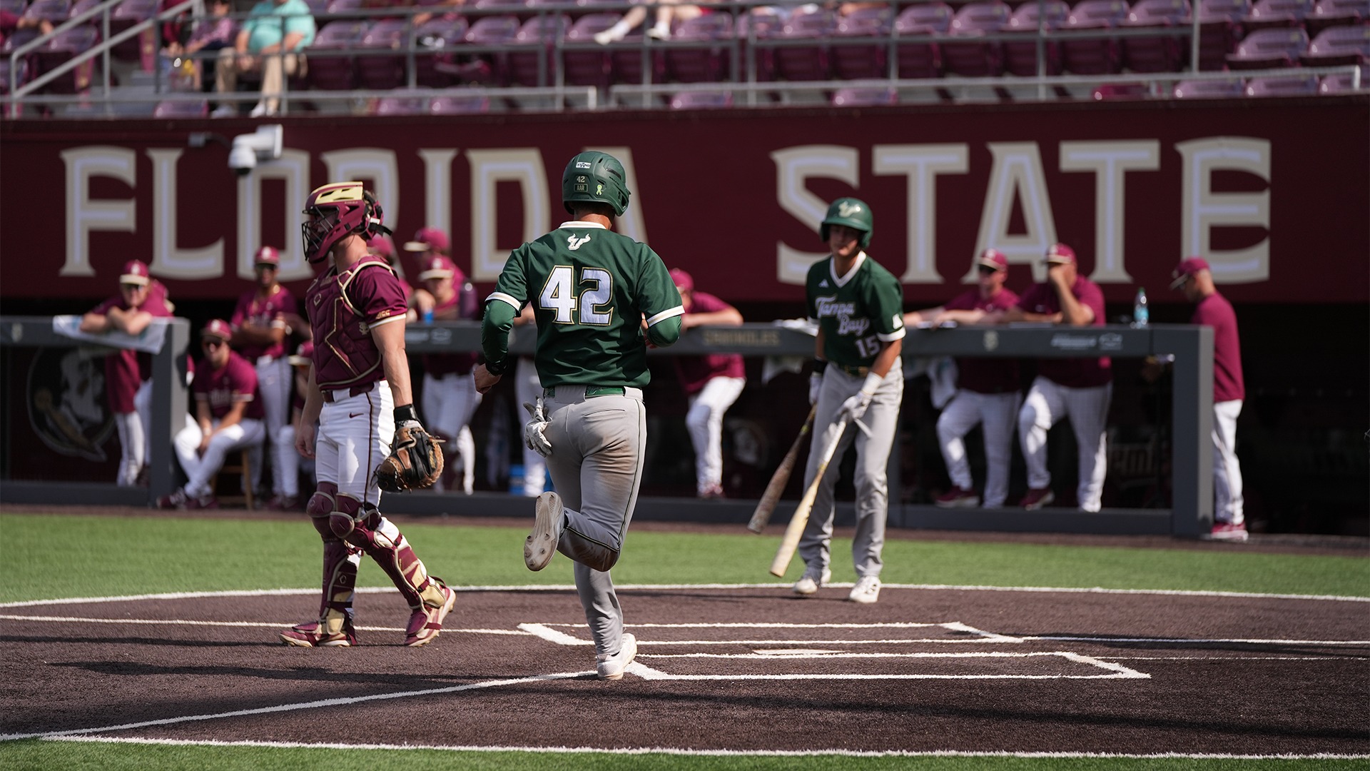 Juan Correa crossing the plate to score.