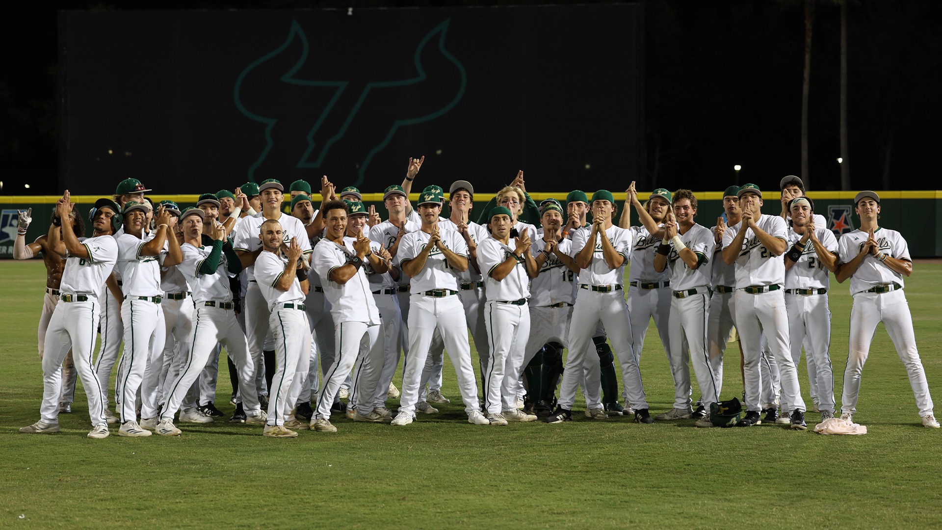 Whole team poses after Jevin Relaford's walk-off to keep postseason hopes alive headed into the final game of the season.