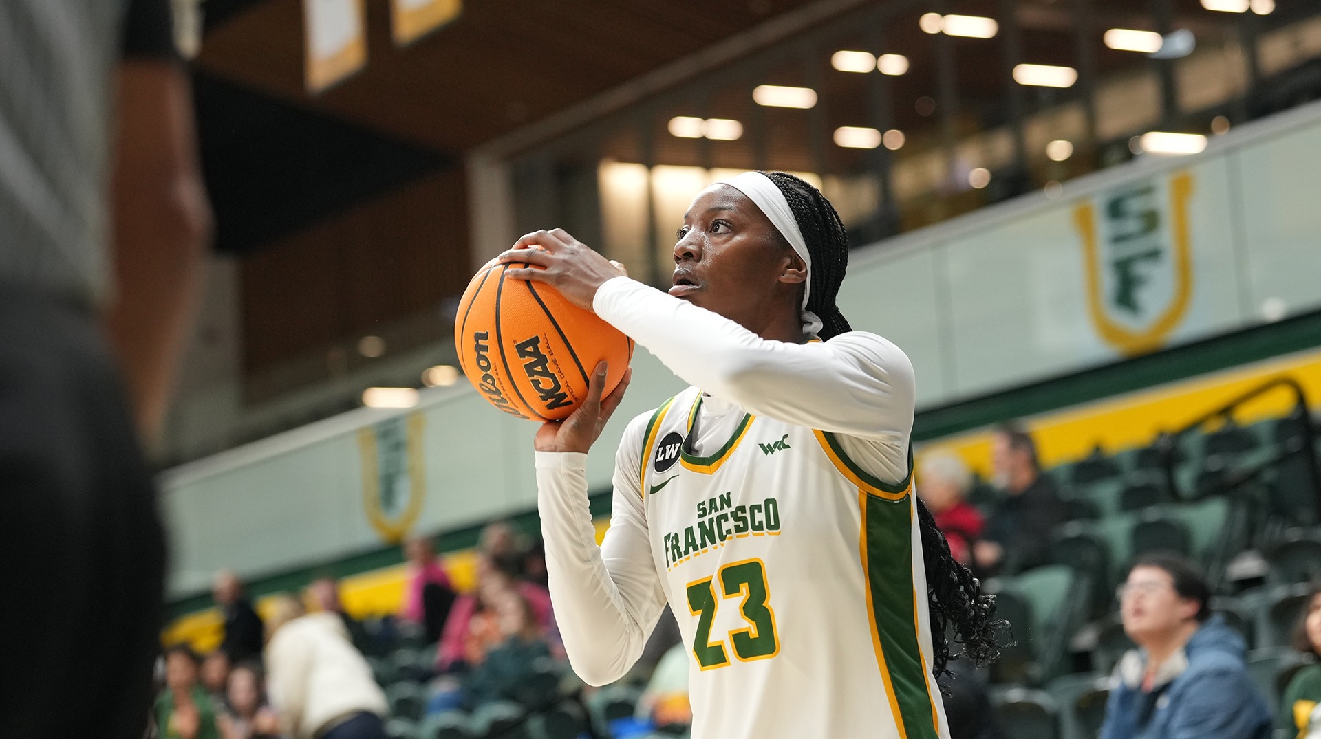 Candy Edokpaigbe shooting a three-pointer vs. Pepperdine 2026