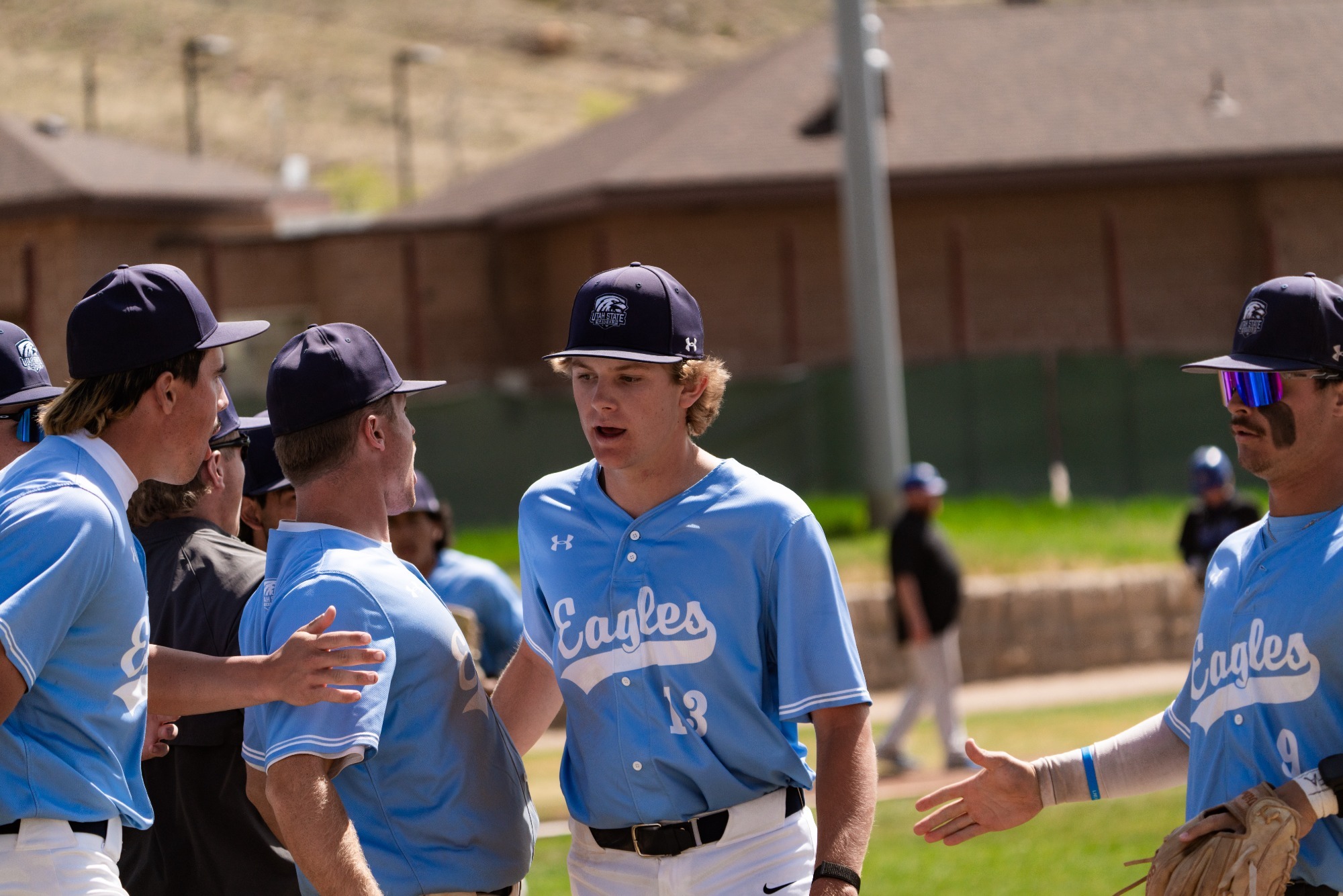 A group of baseball players in light blue 