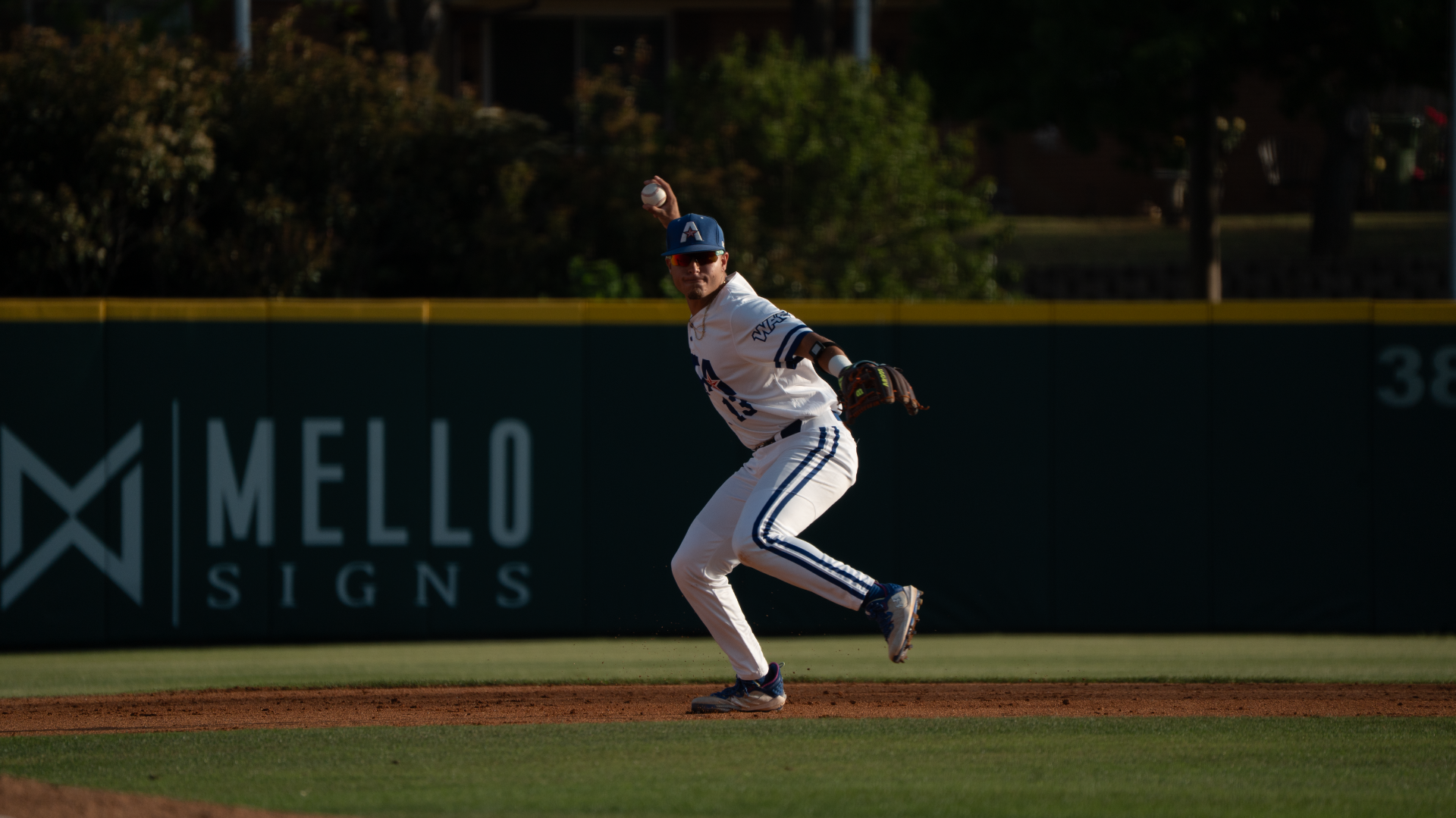Laracuente throwing to first base