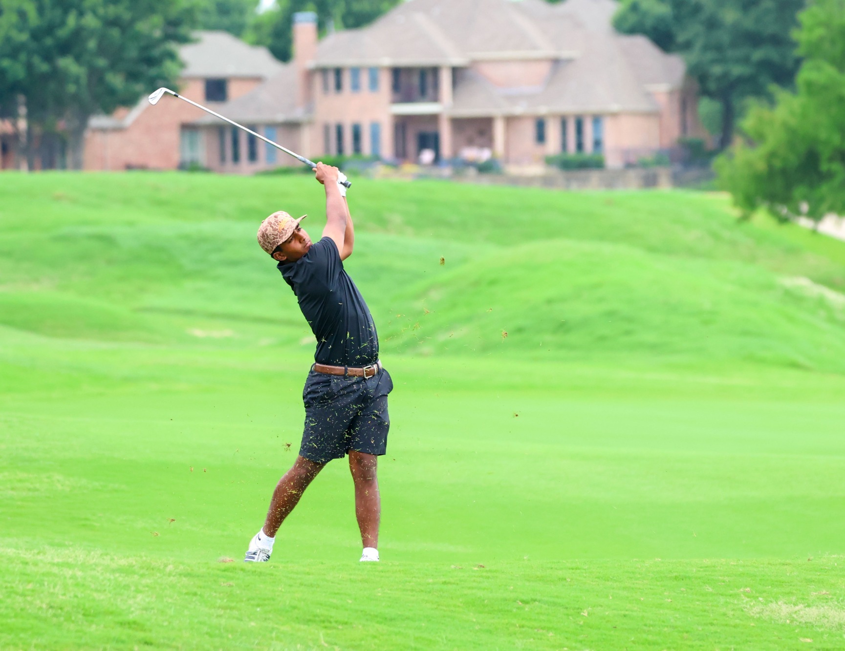 Sinha shoots an approach shot during WAC Tournament round three