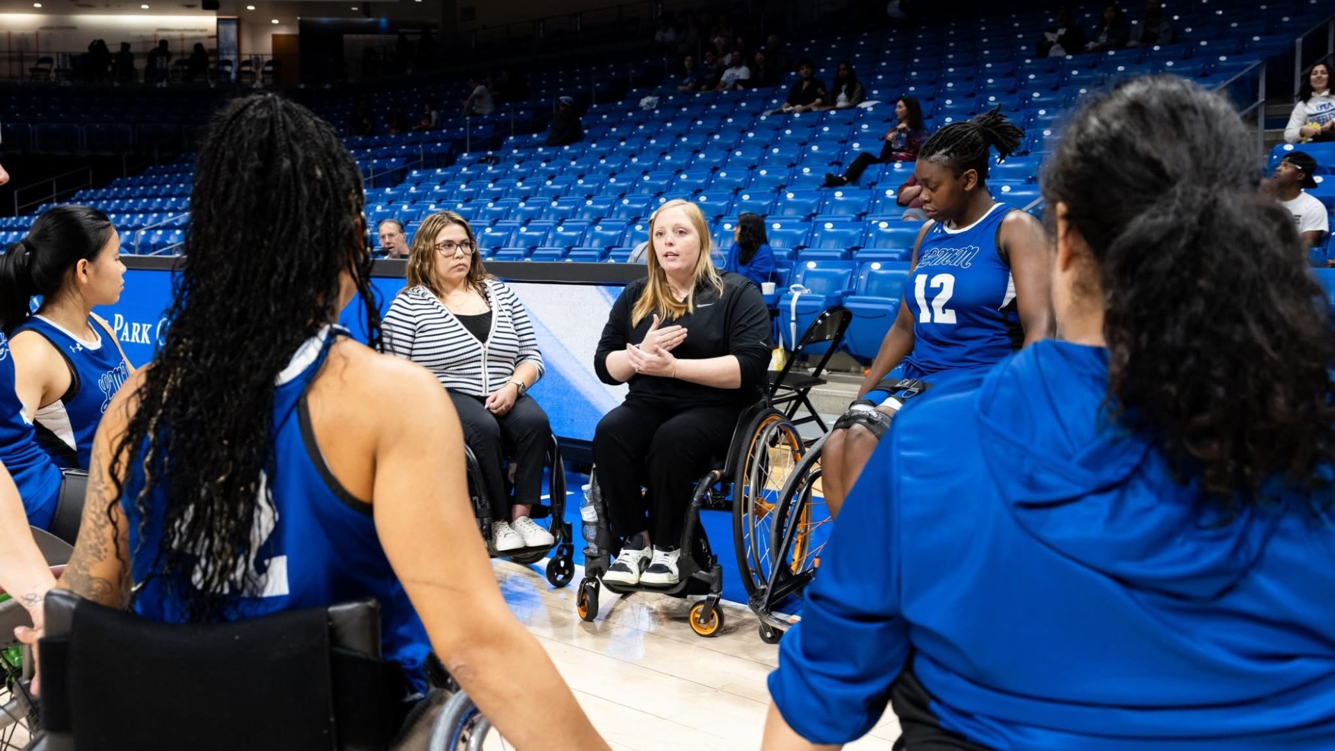 Morgan Wood Speaks to a huddle