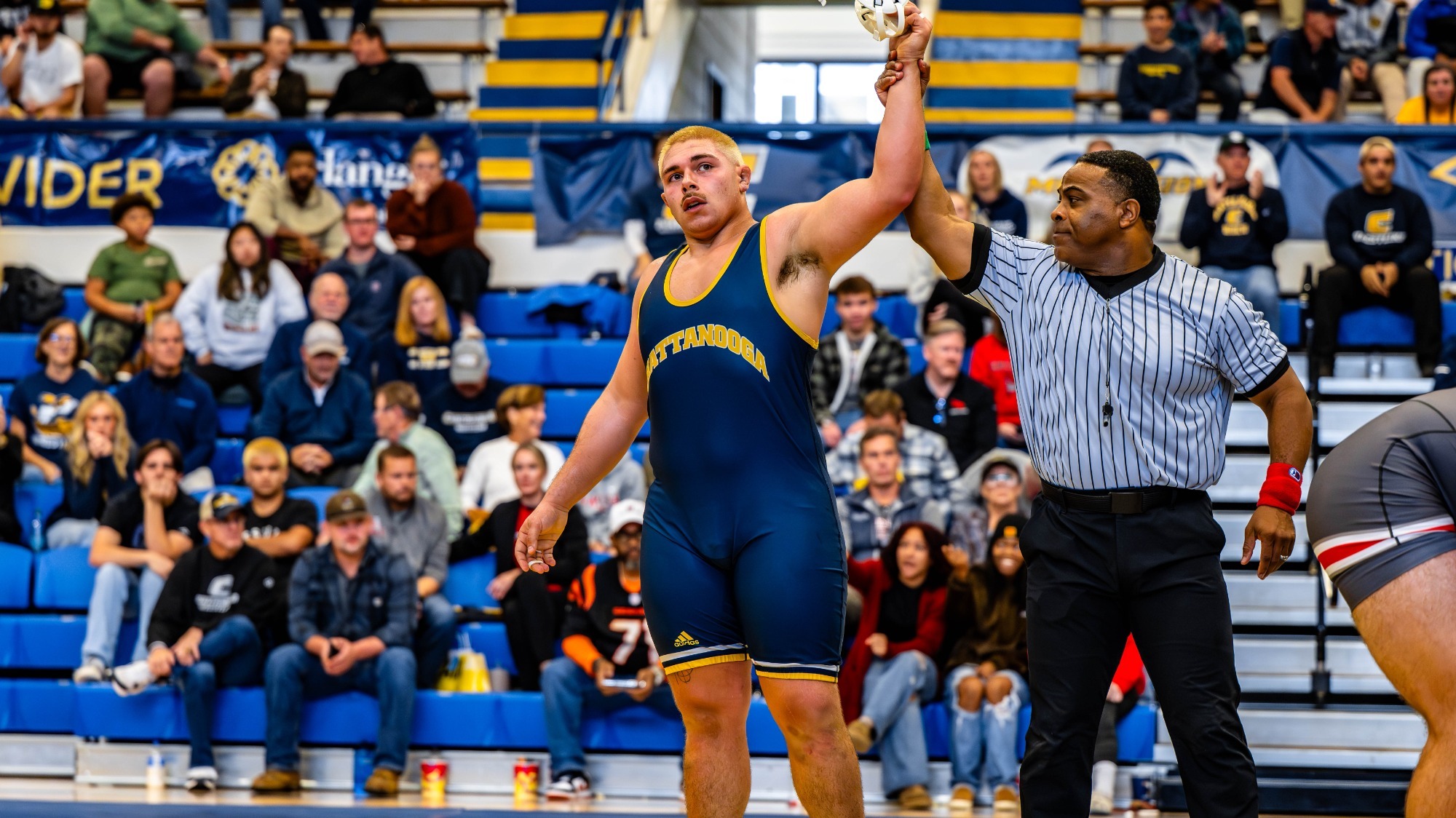 Ethan Vergara's hand is raised after a season opening win