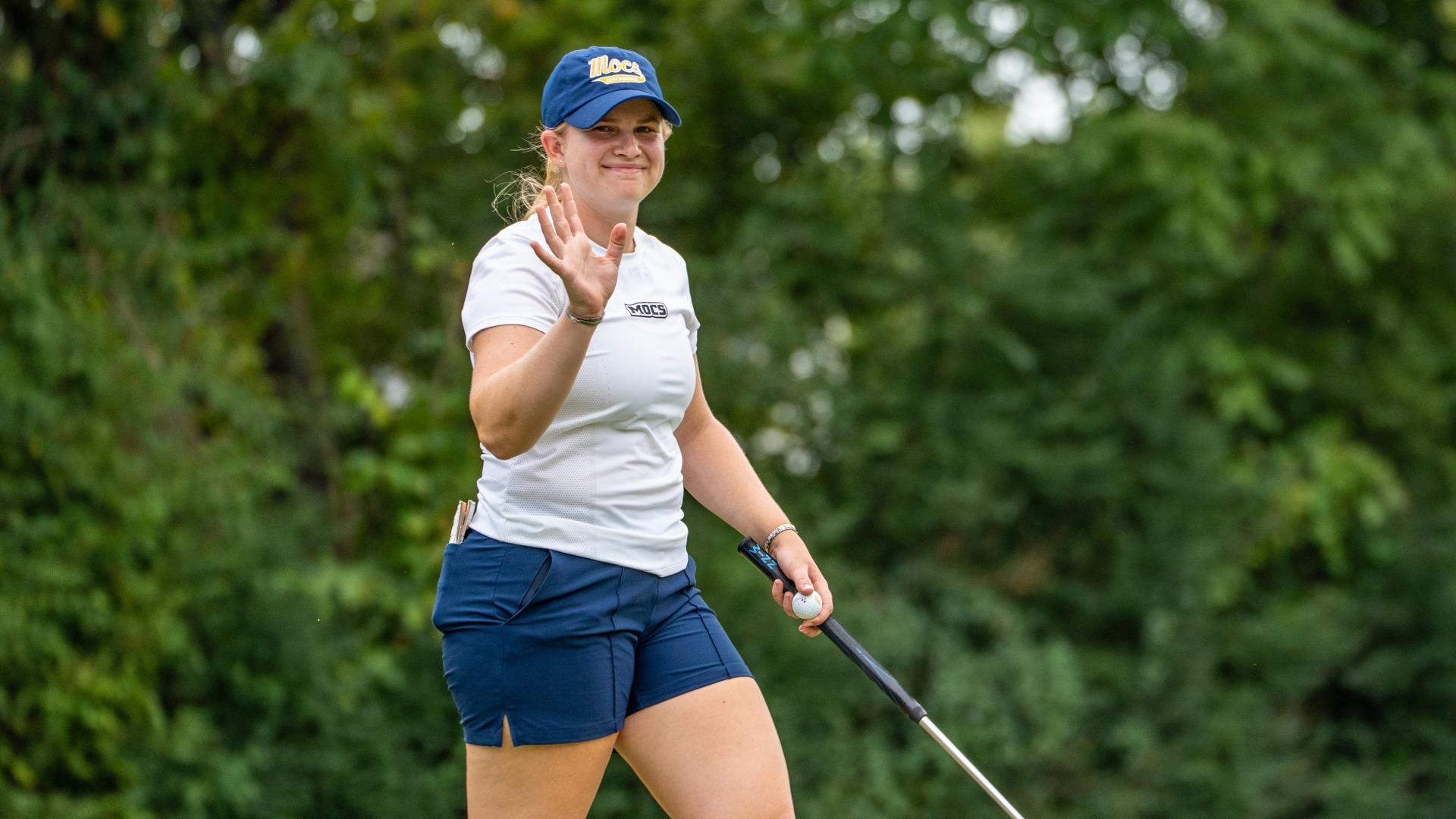 Kera Healey smiles at waves to her fans at Vandy