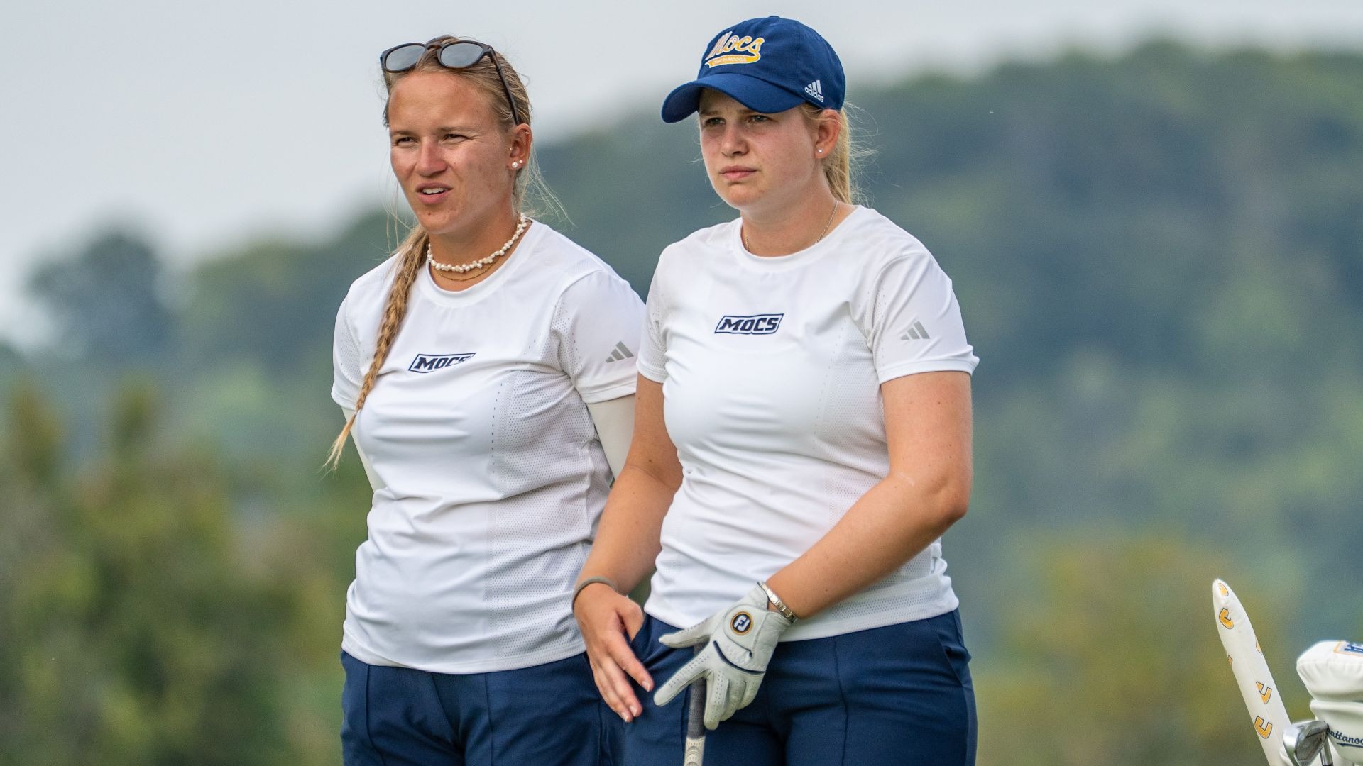 Asst. Coach Carolina Hortian and Kera Healey talk strategy on the tee