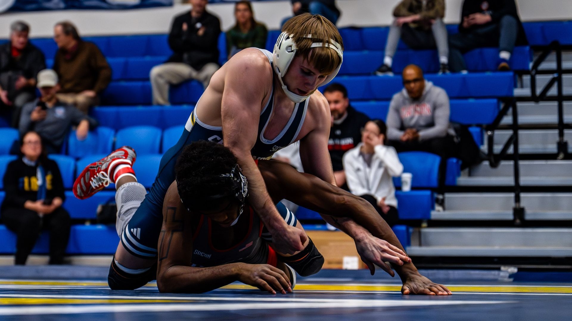 Hunter Mason works in a dominant position on top of his Davidson opponent