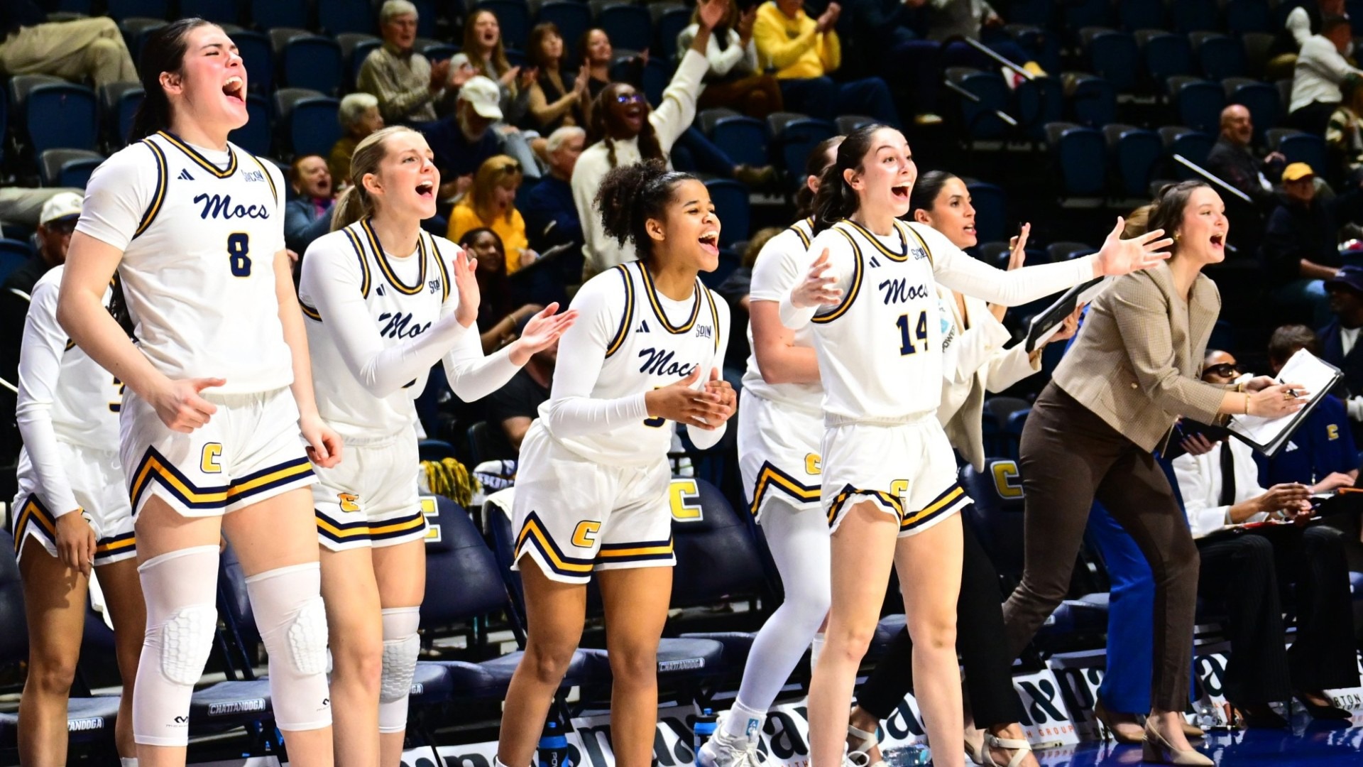 Mocs bench erupts in celebration after a big play in the ladies win over Wofford