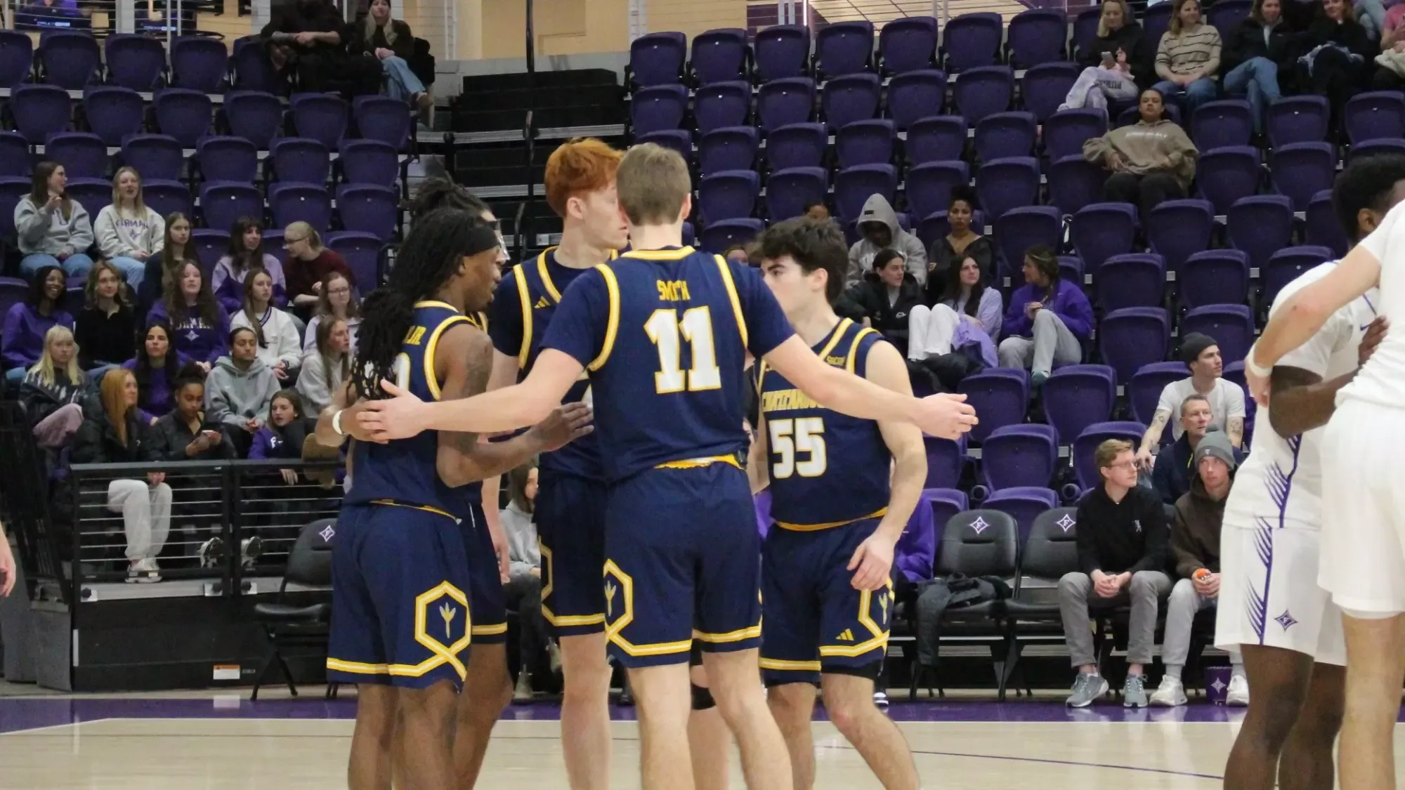 Team huddle at Furman