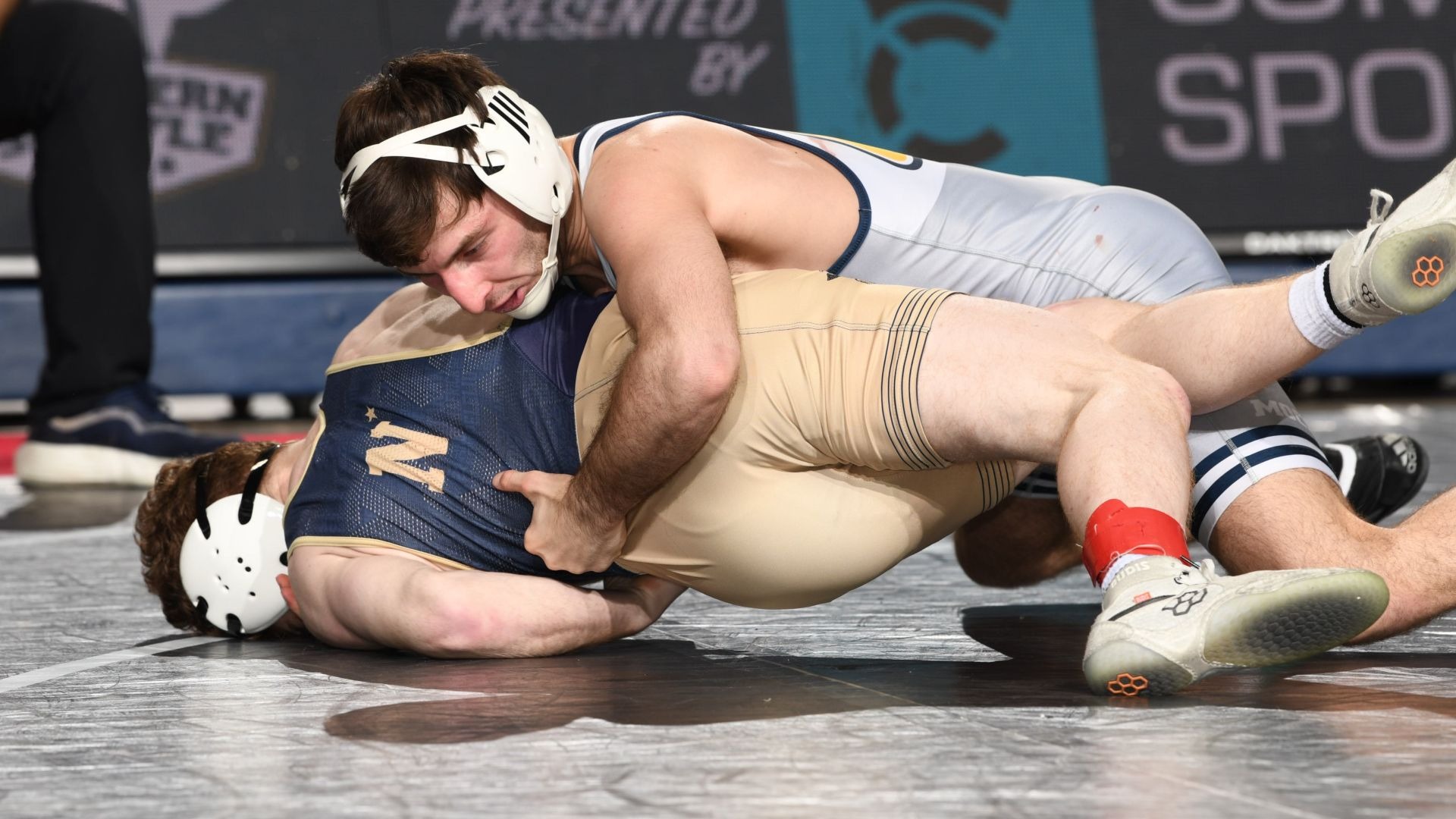 Cooper Flynn looks to turn his Navy opponent to his back during his run to the Southern Scuffle podium in 2026