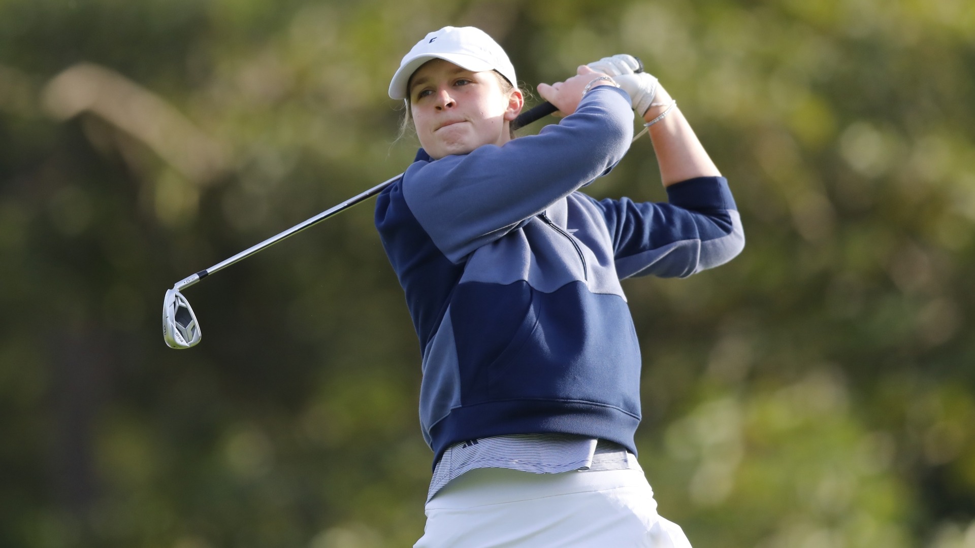 Erin Wells follows her shot in Guadalajara