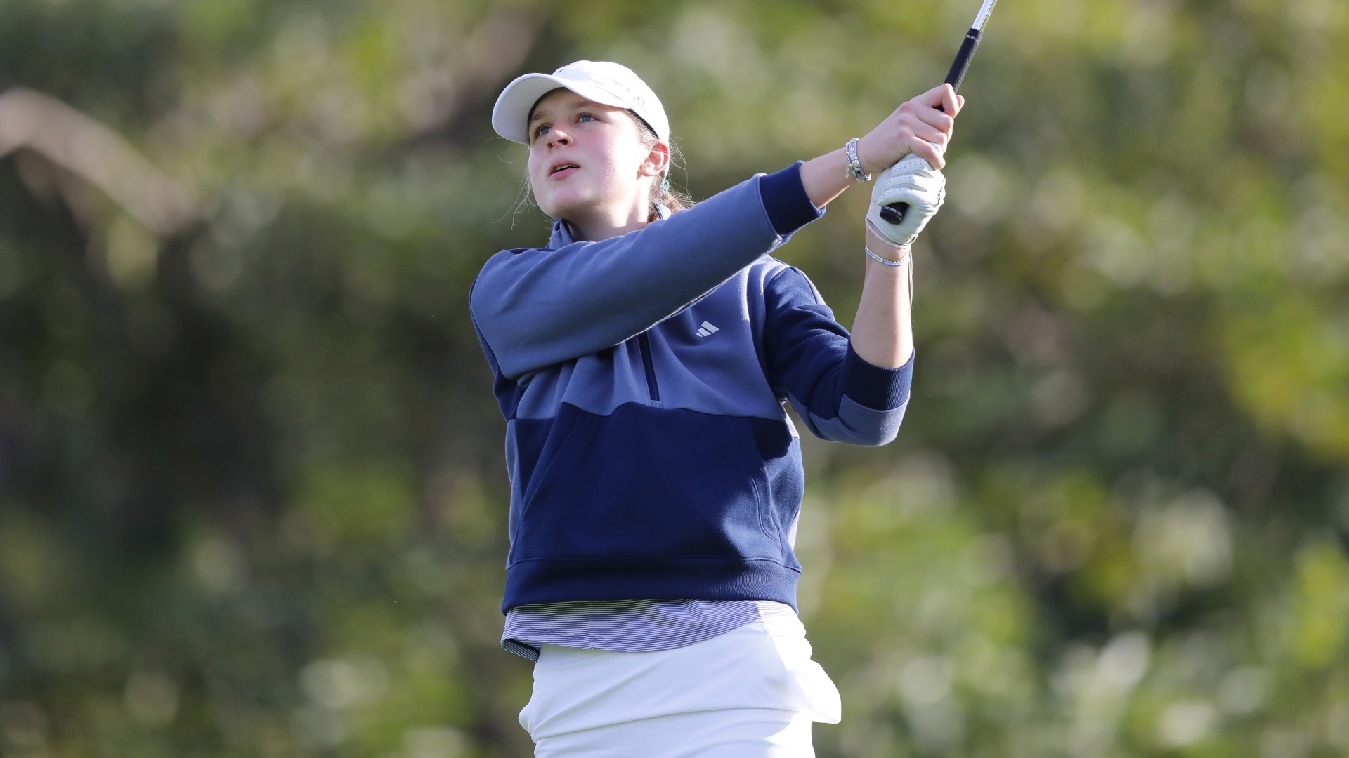 Erin Wells poses with her club aimed at the target post-swing as she follows her shot.