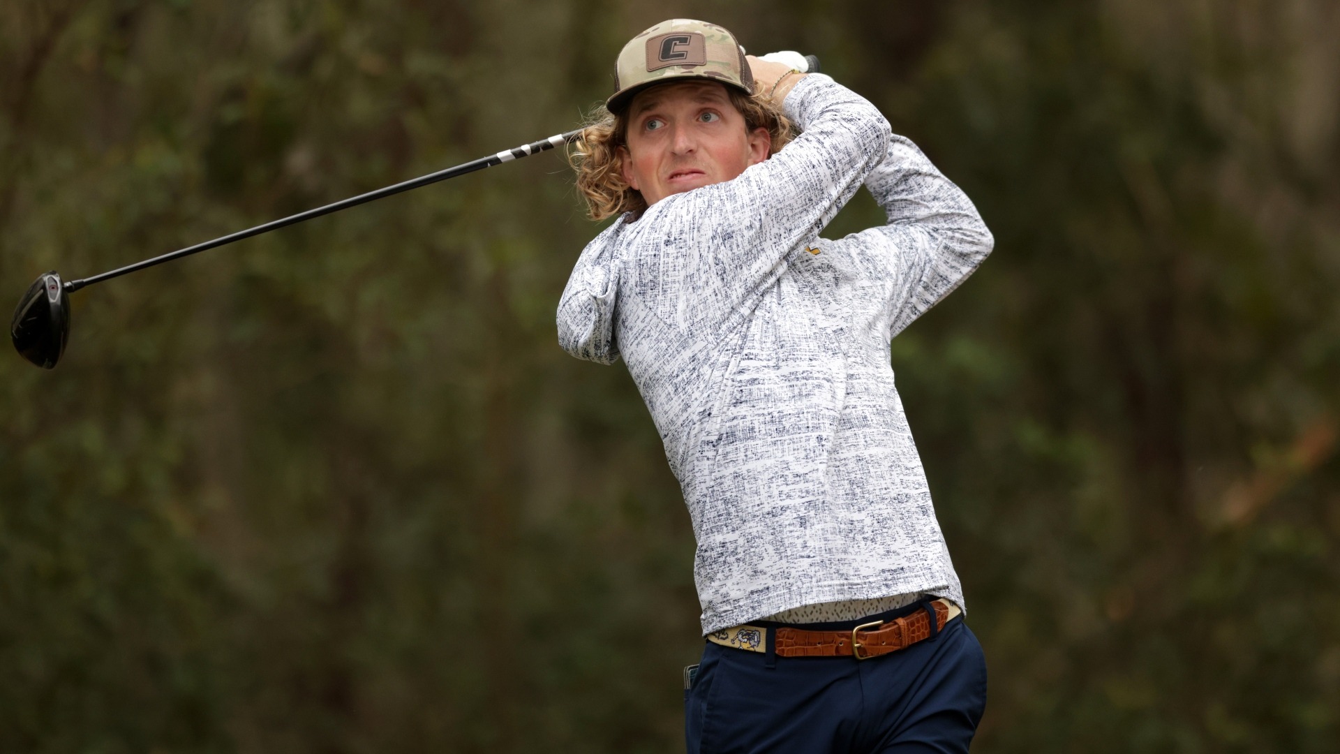 Camden Braidech holds his pose at the top of his drive at the Colleton River Club.