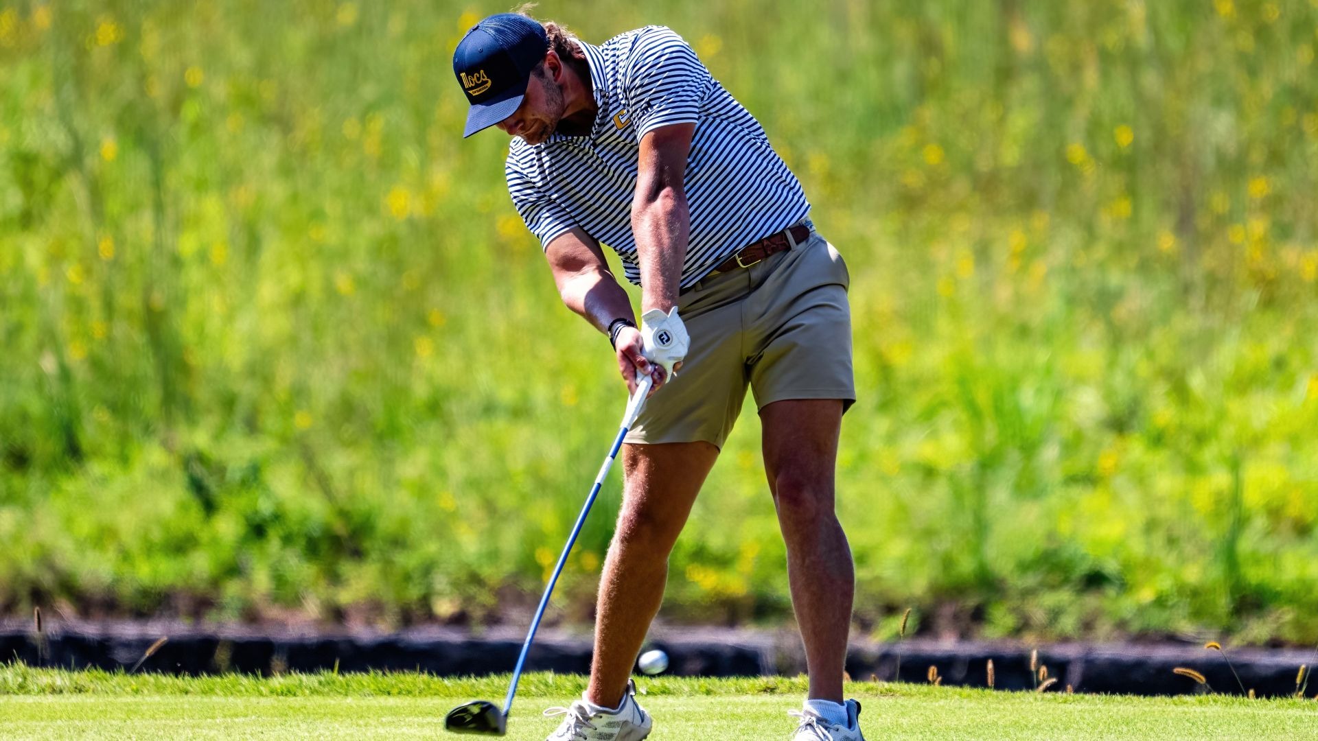 Ward Harris makes contact on his drive at the Honors Course