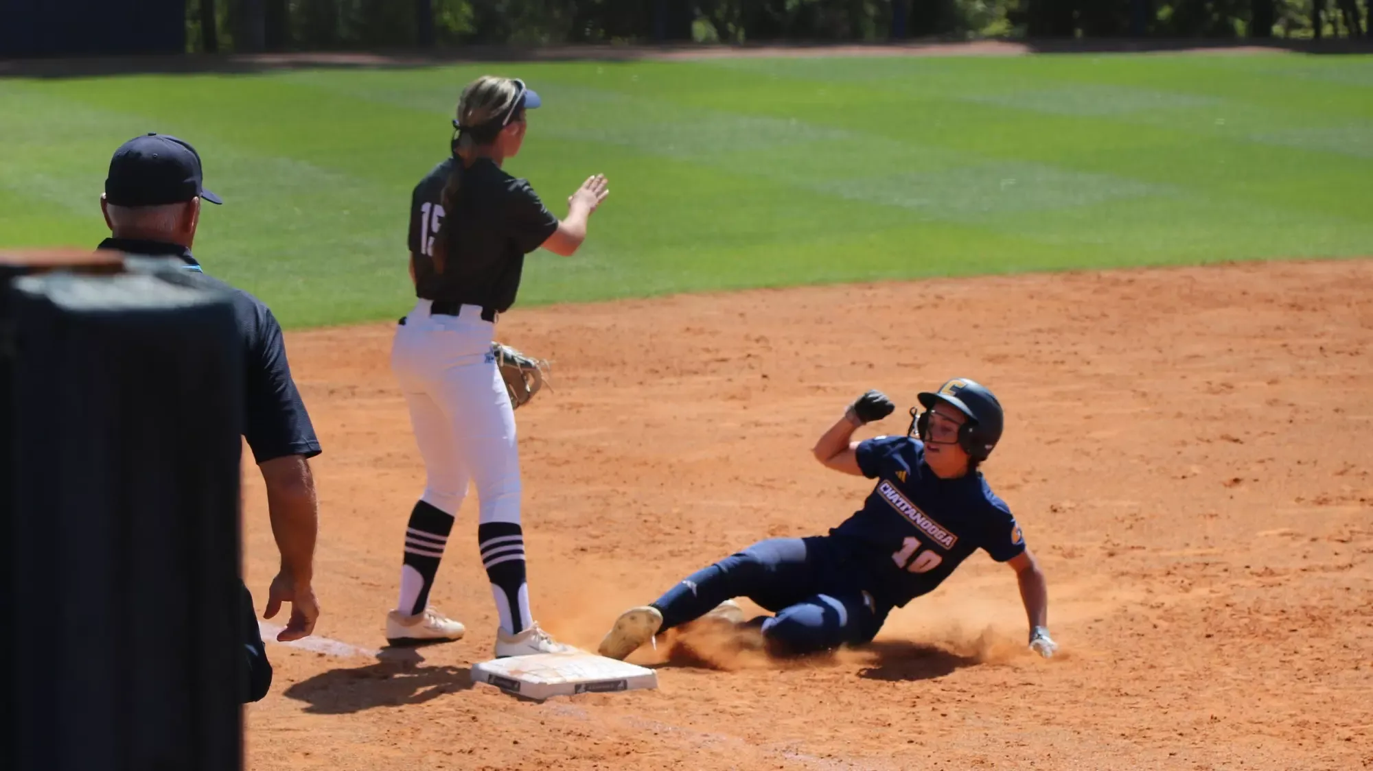 Ava Cowart slides into third base.