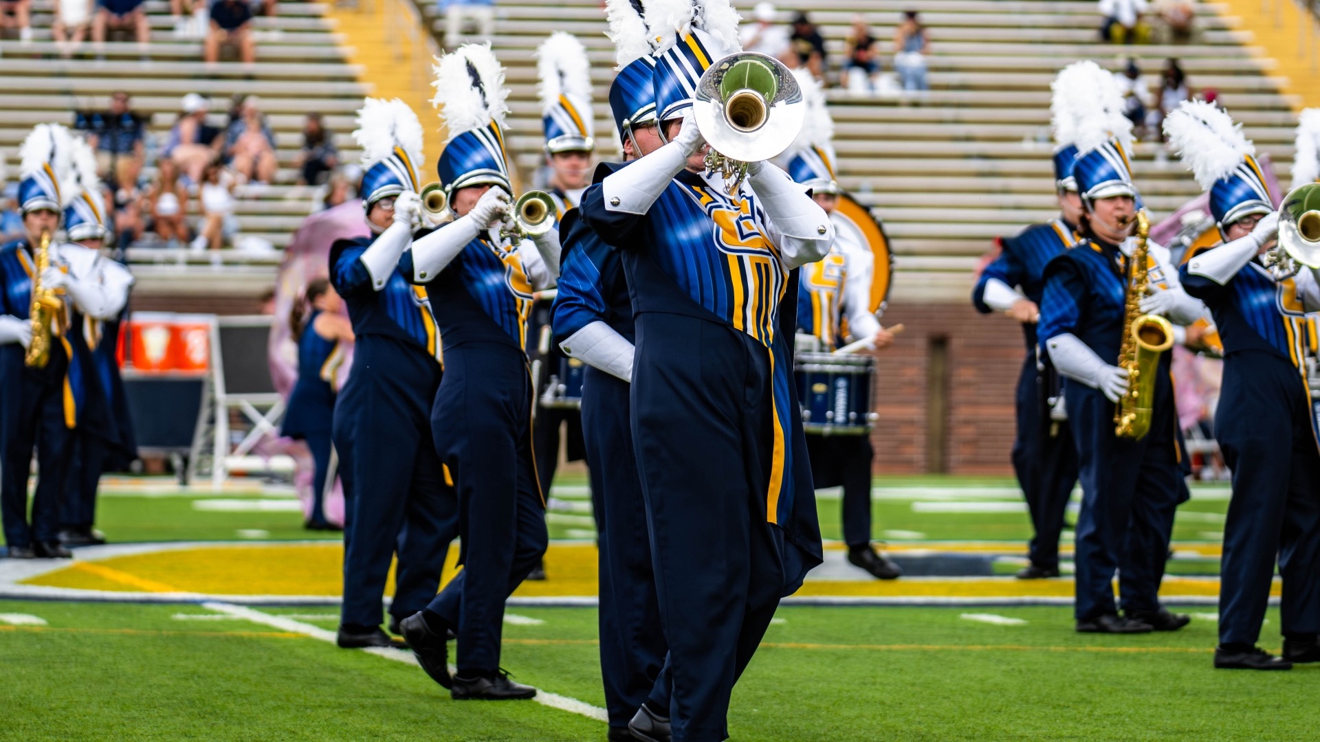 The Marching Mocs horn section performs at halftime of the ETSU contest
