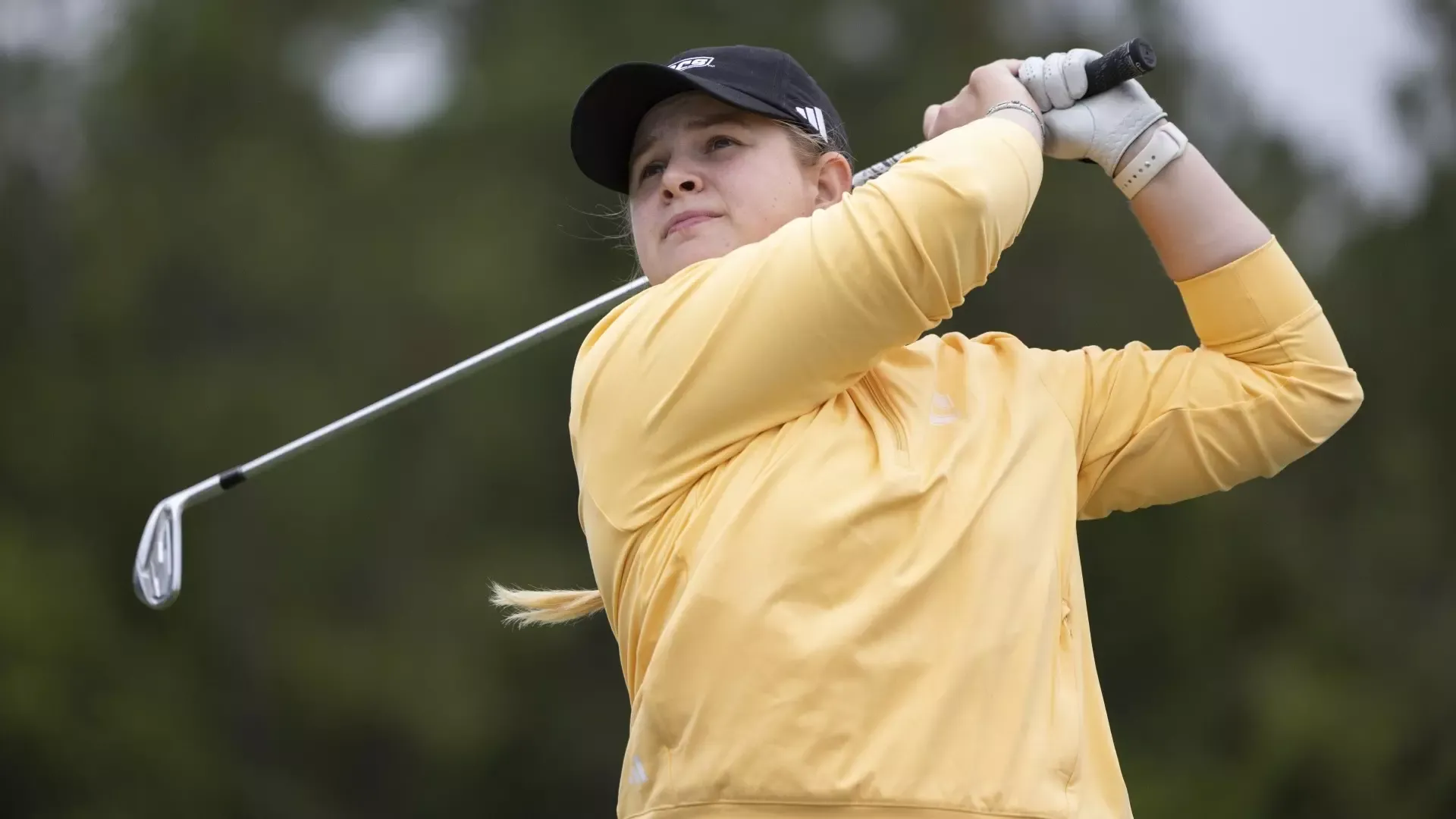 Kera Healey watches her approach lofted high in the air posing in a high-finish position