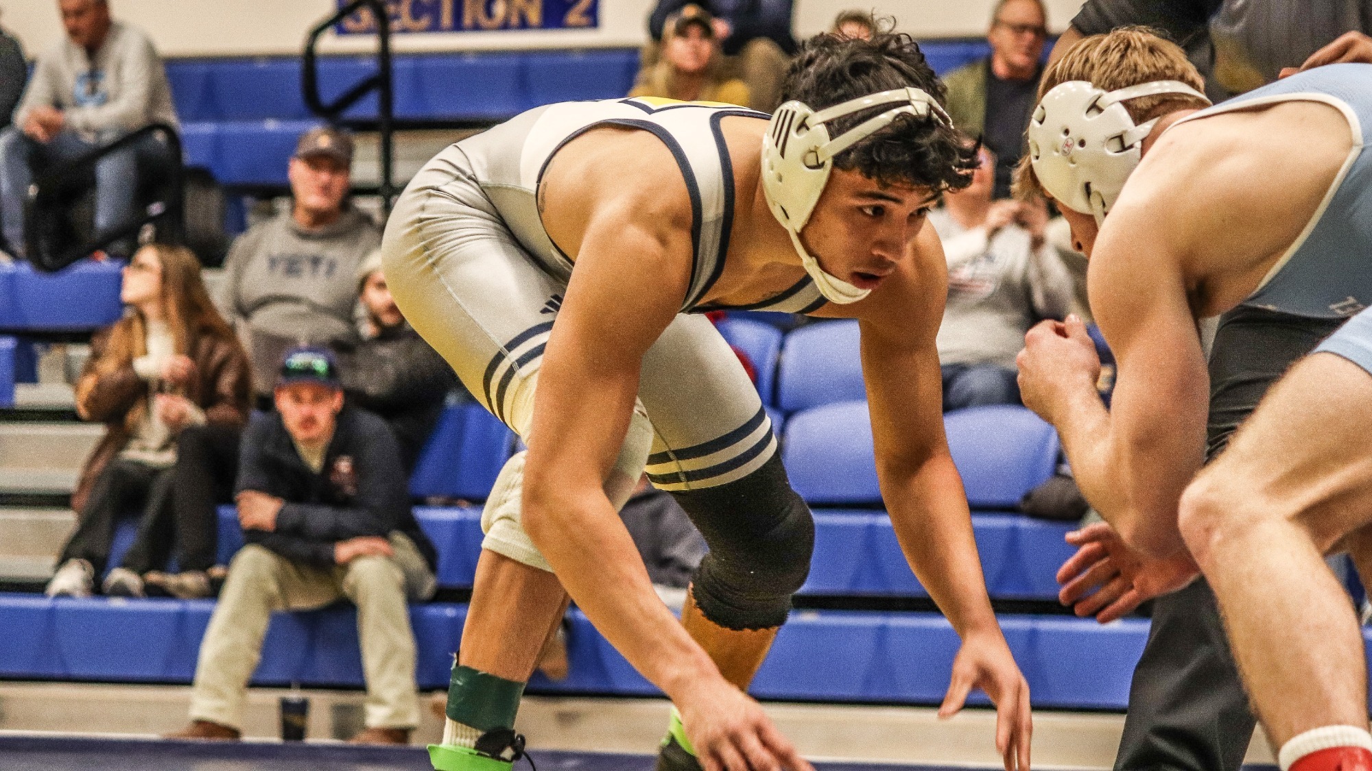 Yuta Otero begins his match in a crouch looking for an opening