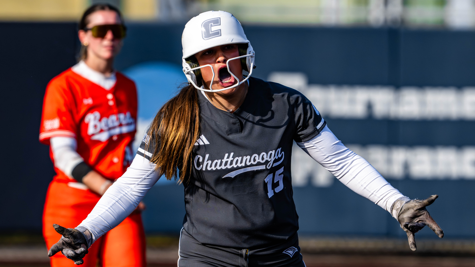 A Chattanooga softball player is celebrating a good hit at second base.