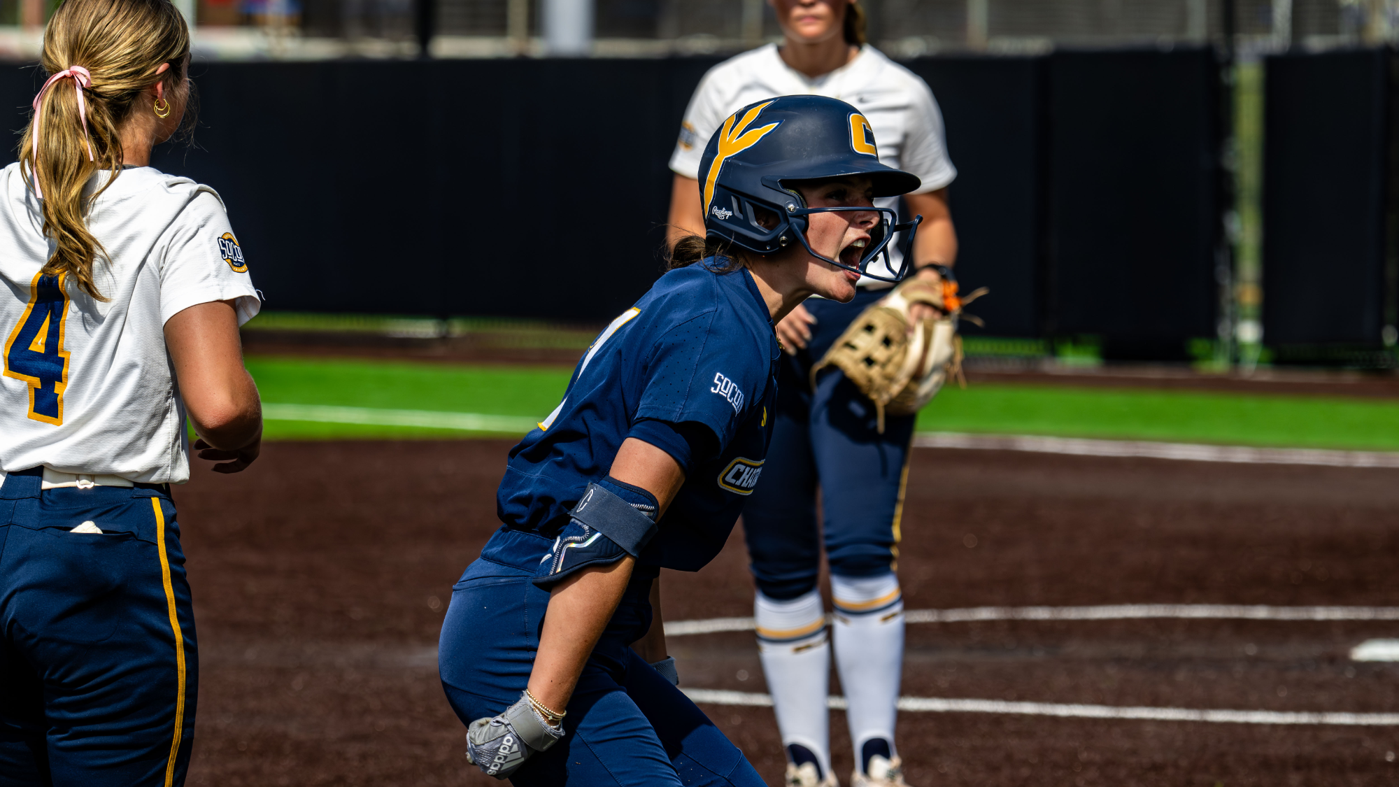 Softball player celebrates after driving in the game-winning runs.