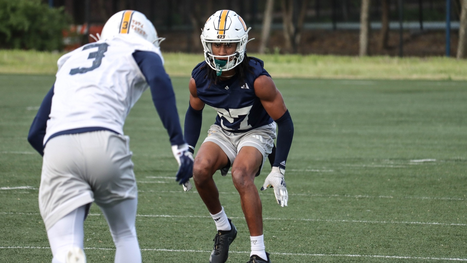 DJ Adams starts his backpeddle as the receiver comes off the line of scrimmage.