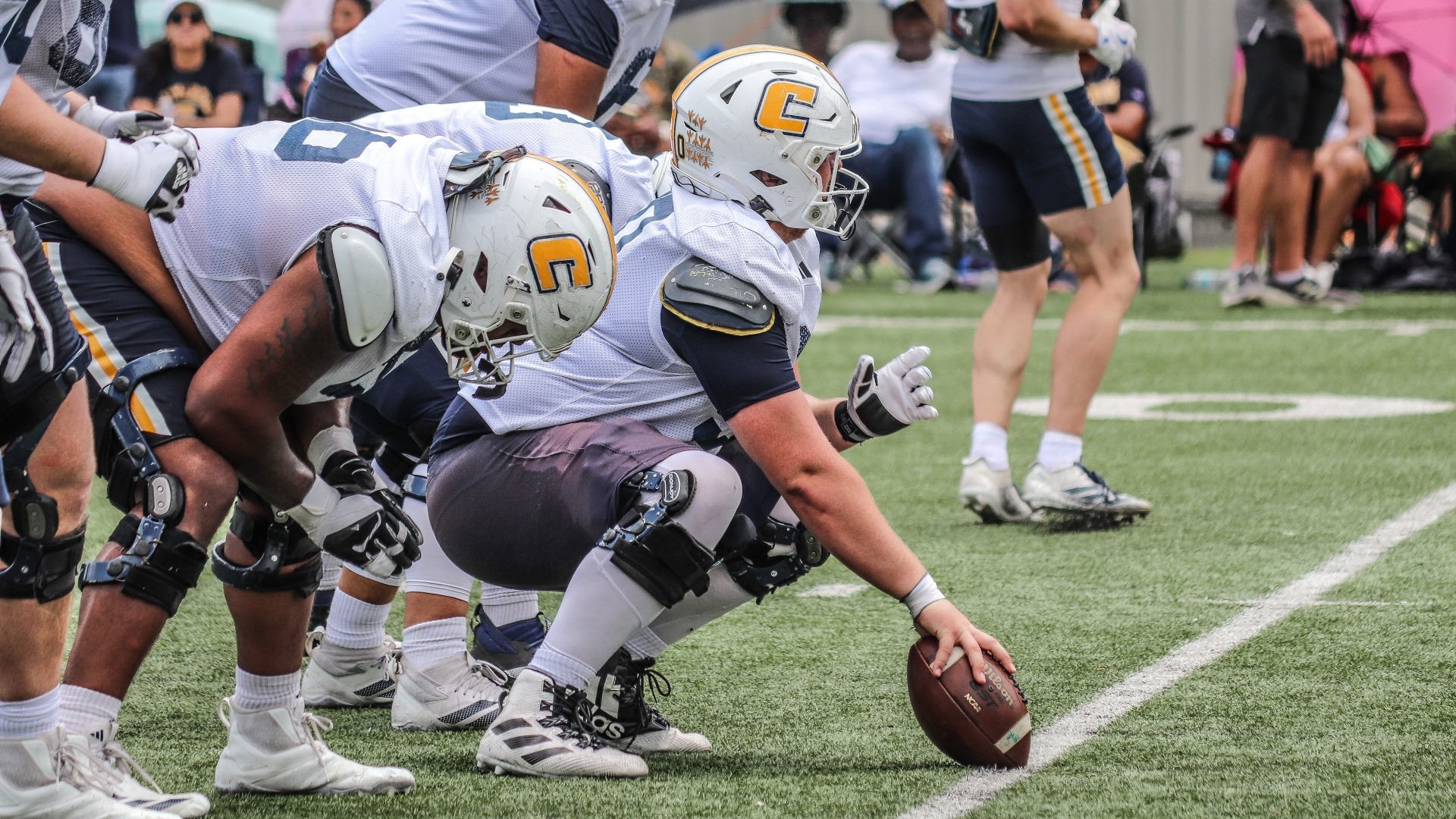 Center Devin Lively peruses the defense in a crouch pre-snap in Spring Showcase 