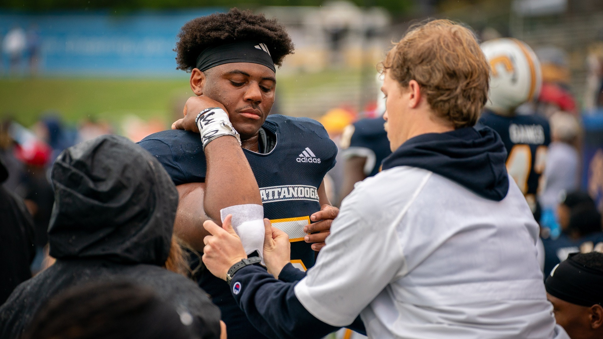 Sports medicine staff bandage Kameron Brown's elbow in the 2024 win over VMI