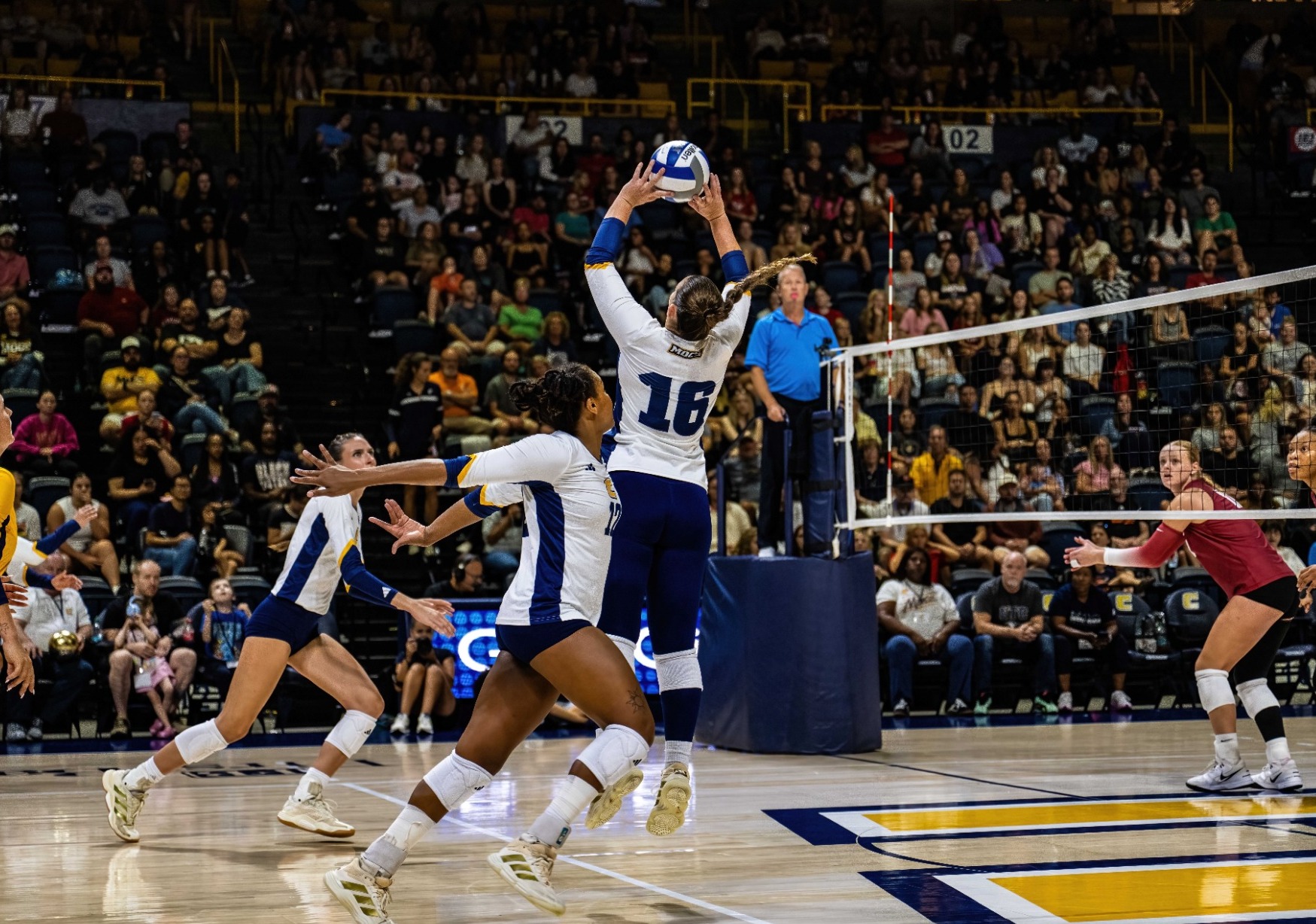 Ashley Reynolds set the volleyball in UTC's match against Alabama at McKenzie Arena