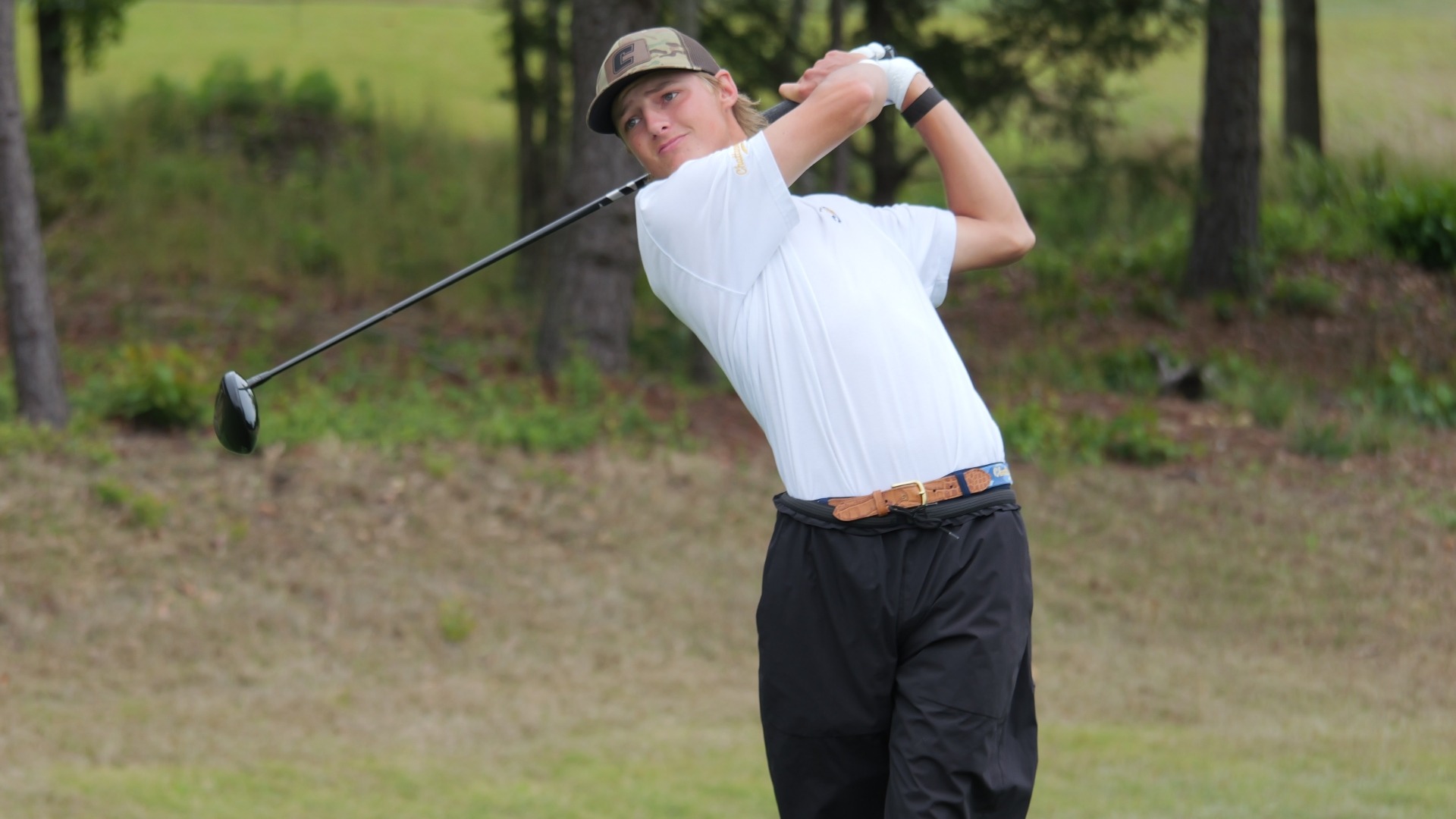 Evan Rogers completes his swing on a drive in the second round of the SoCon Championships
