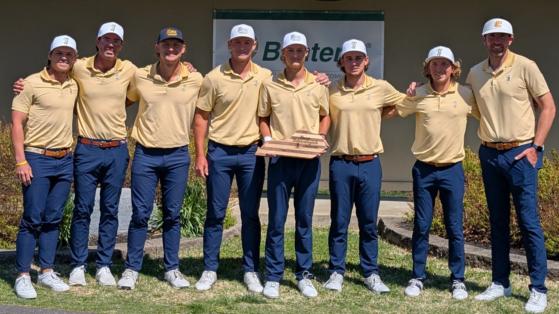 Mocs team and coaches pose for a picture with Racer Intercollegiate trophy.