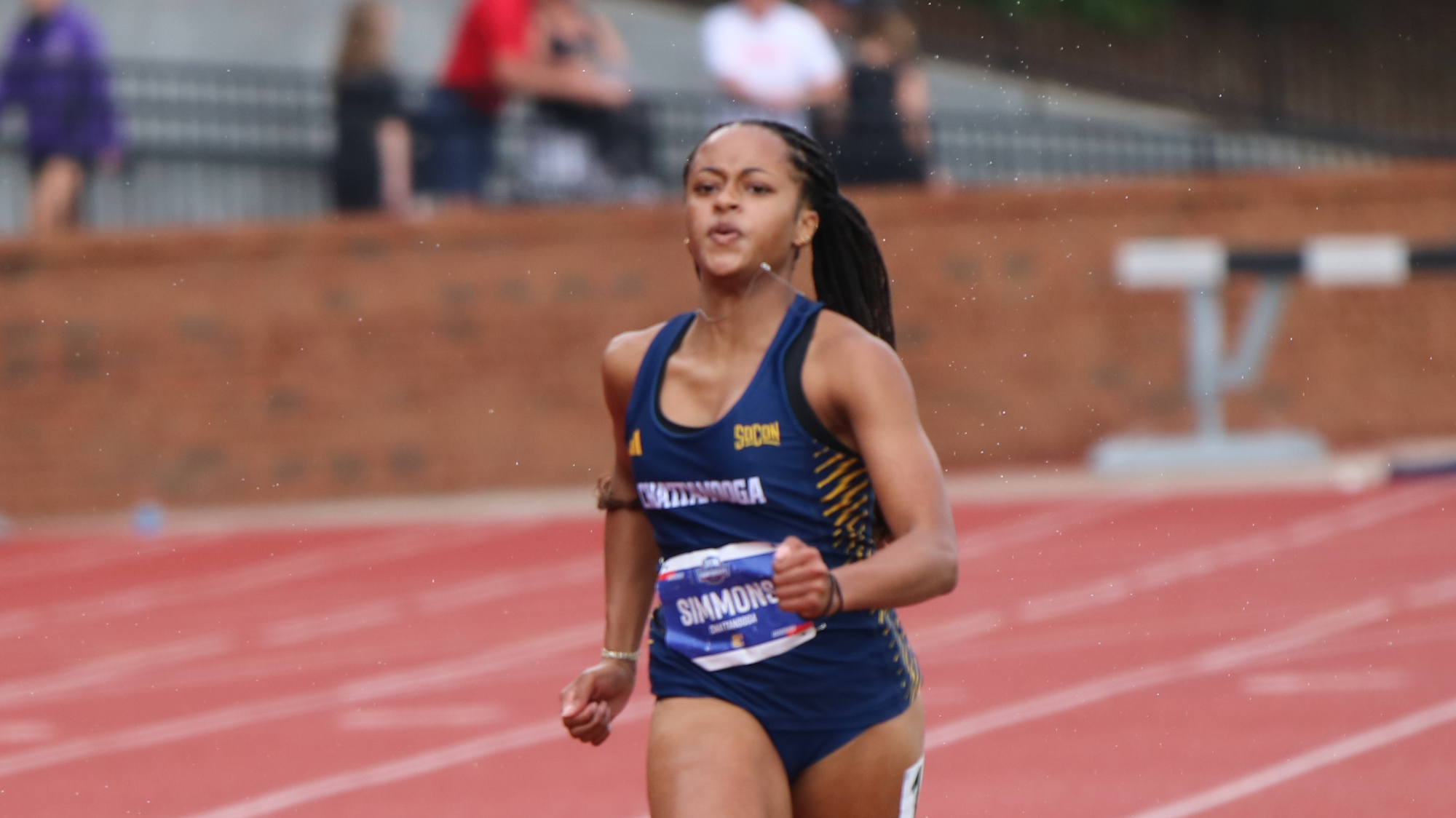 A sprinter is running a race on a track.