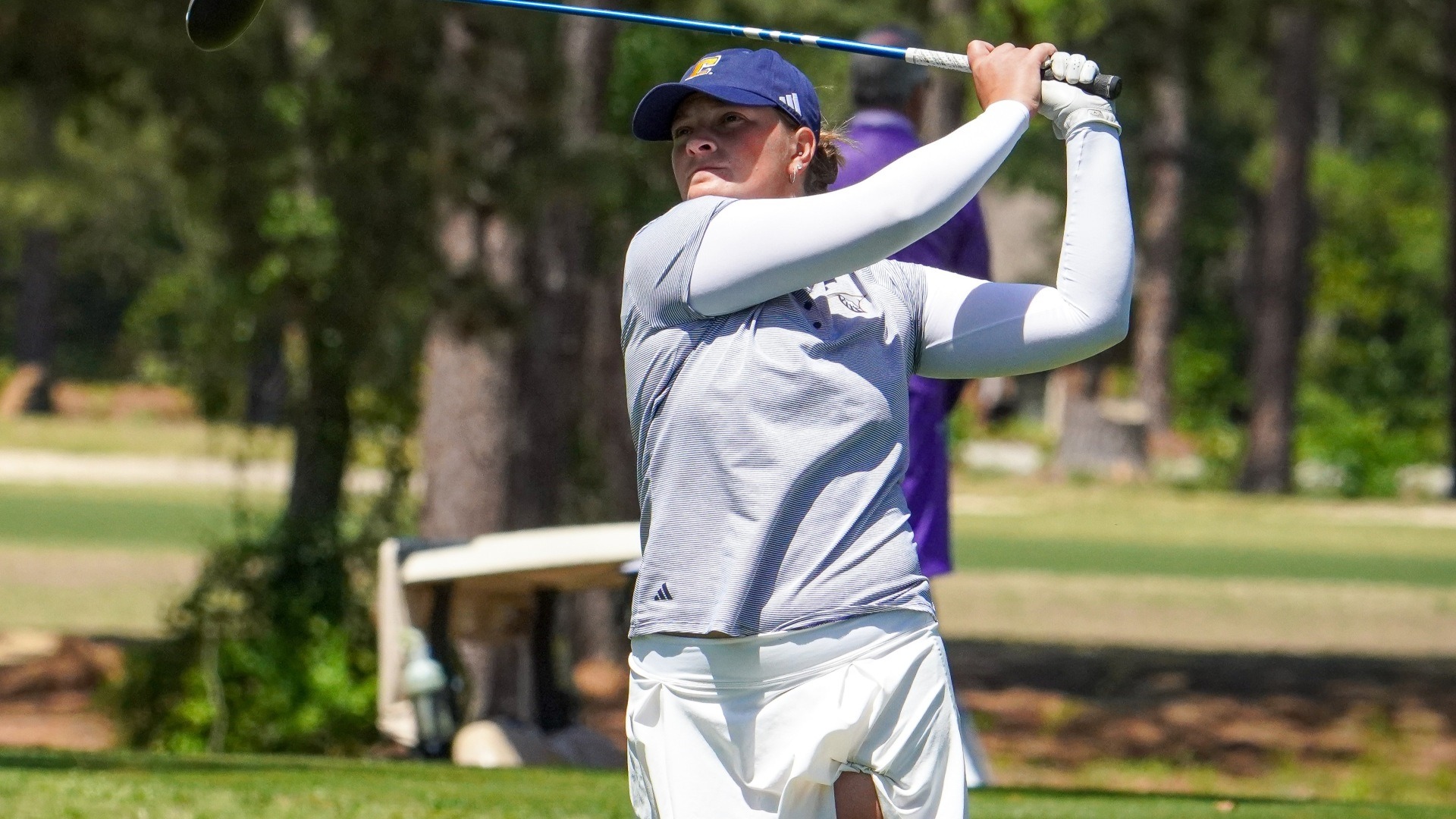 Bella Bugg holds her finish with a fairway metal at the Southern Conference Championships