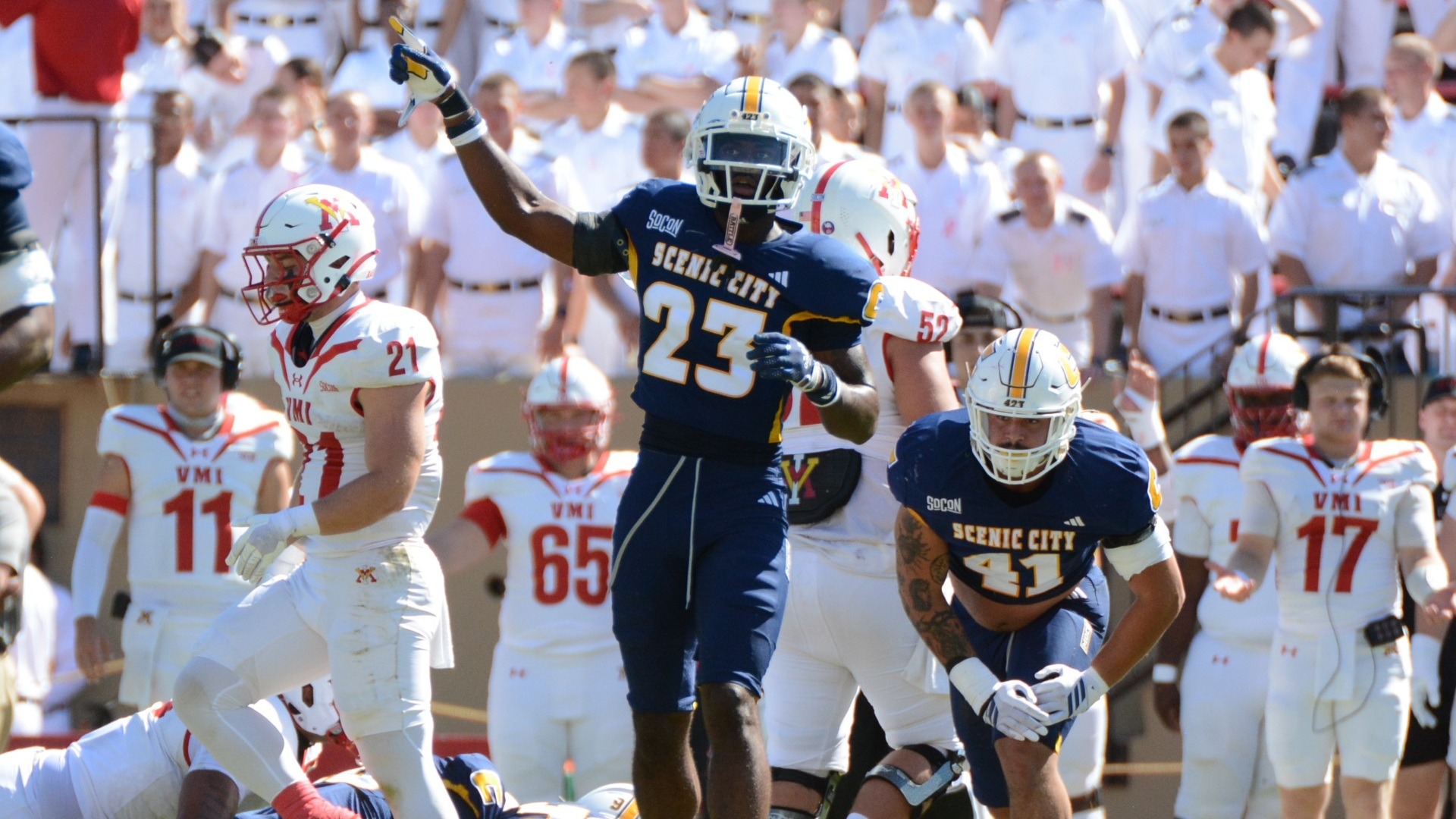 Kam Baah-Slay helps the officials by pointing the Mocs direction on a turnover call.