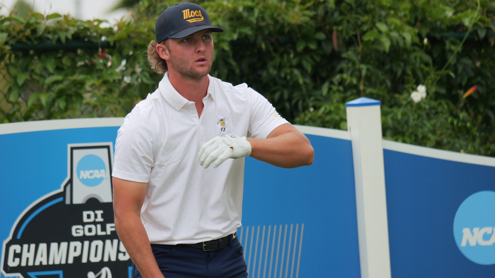 Ward Harris straightens his sleeve on the tee as he considers his options at the NCAA Championships